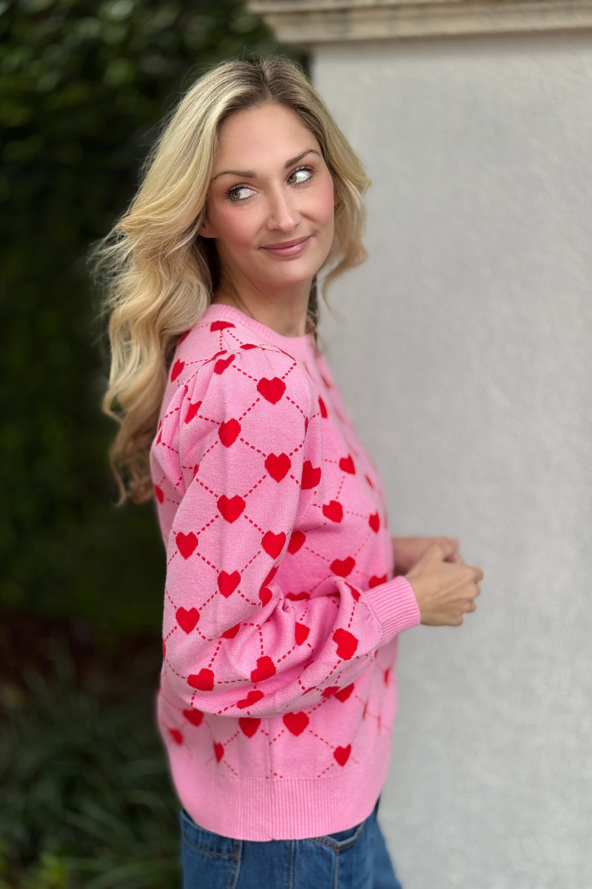Cute Valentine sweater styled with denim skirt