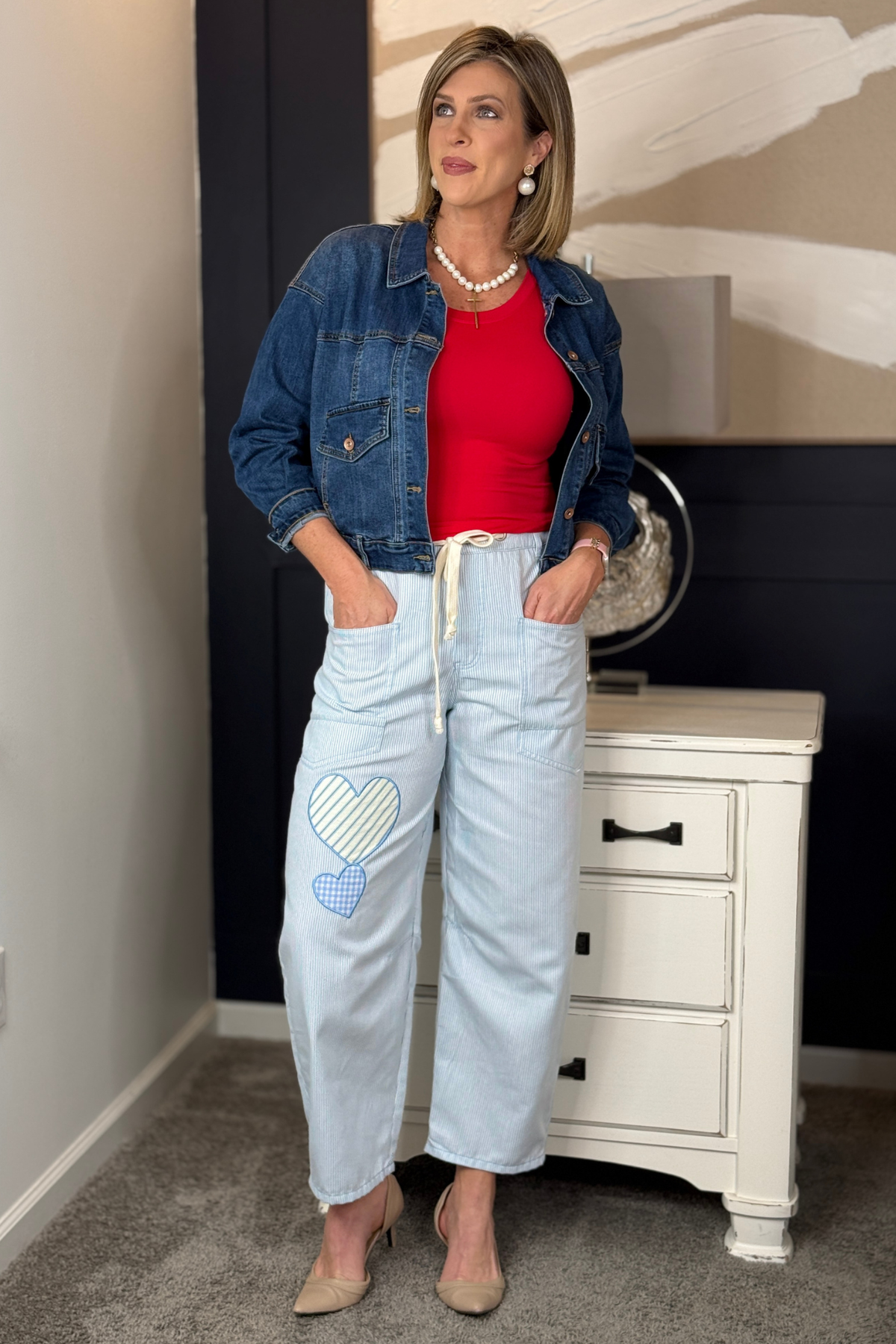 Baby blue striped drawstring pants with heart appliqués