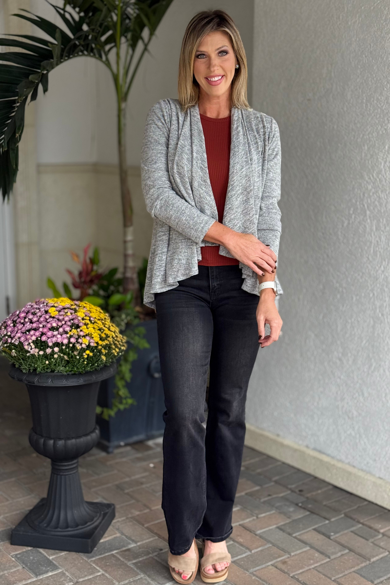 Front view of The Between Seasons Cardigan in charcoal black, worn open as a relaxed cardigan.