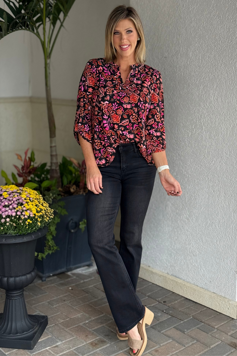 Close-up of ¾ sleeve tab details on the TPN Jetsetter Floral Printed Top in black.