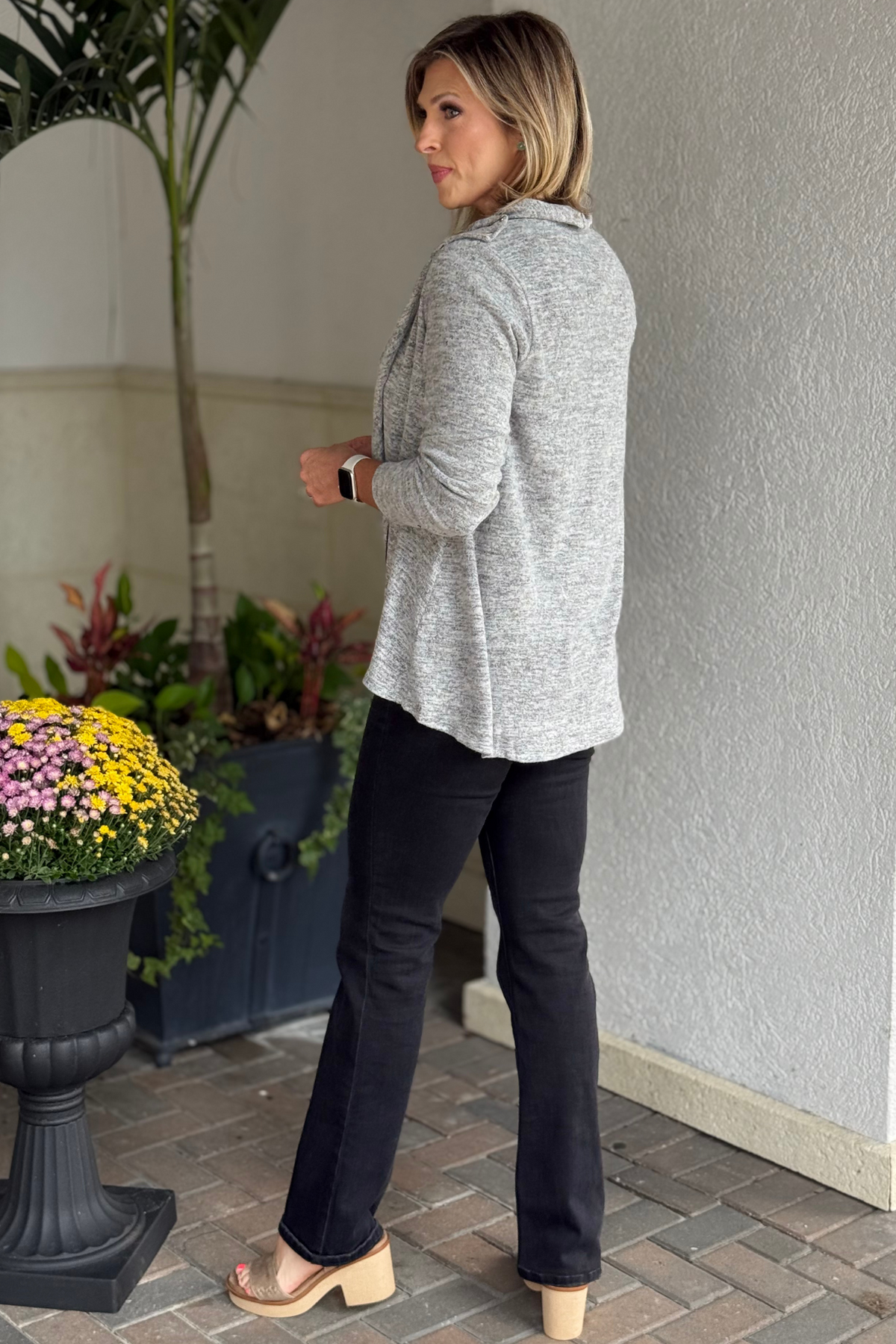 Close-up of soft cashmere hacci fabric on The Between Seasons Cardigan in charcoal black.