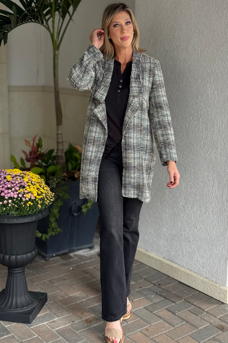 Close-up of textured tweed fabric on the TPN Brixton Midi Blazer.
