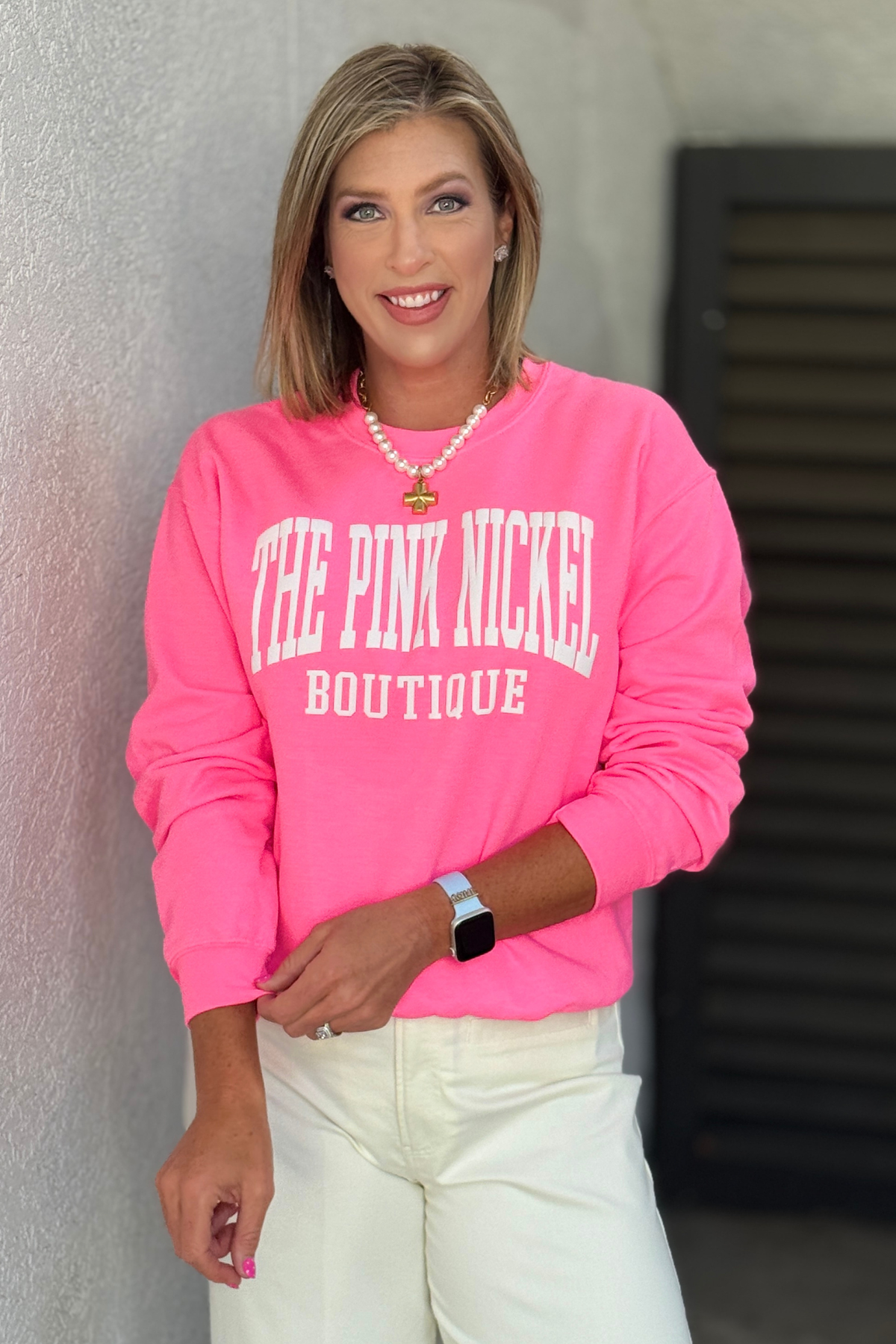 Pink crewneck sweatshirt with puff graphic