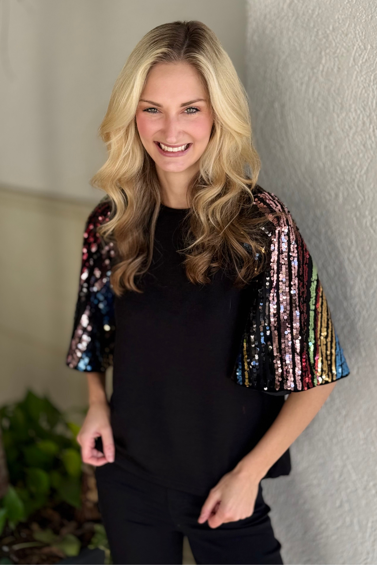 Black THML top with shimmer bell sleeves