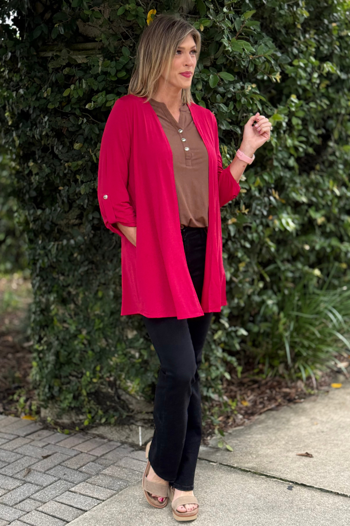 Model wearing TPN Jewel Essential Open Cardigan in Jewel Red made from wrinkle-free Bulgari fabric.