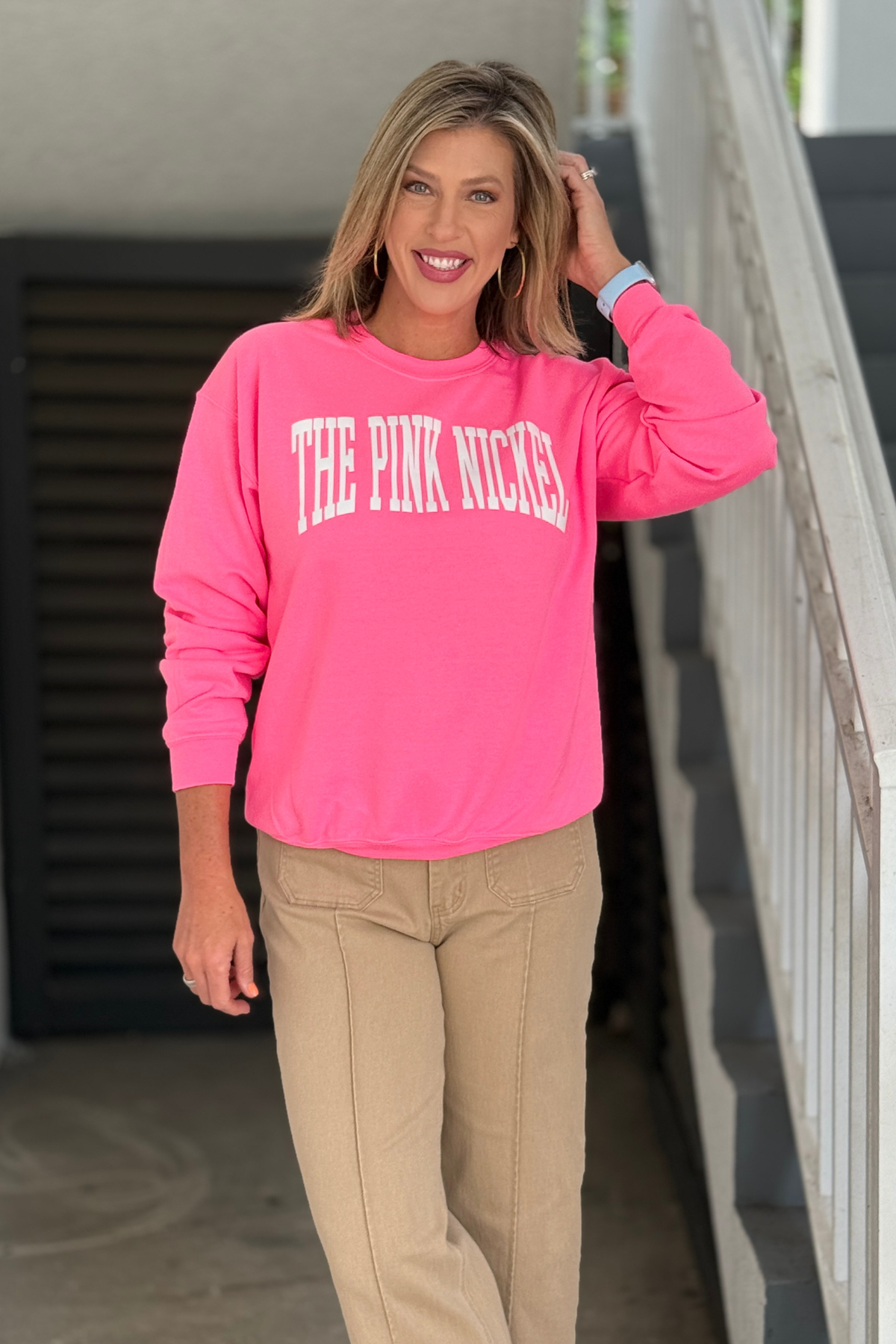 The Pink Nickel boutique logo sweatshirt styled with camel pants