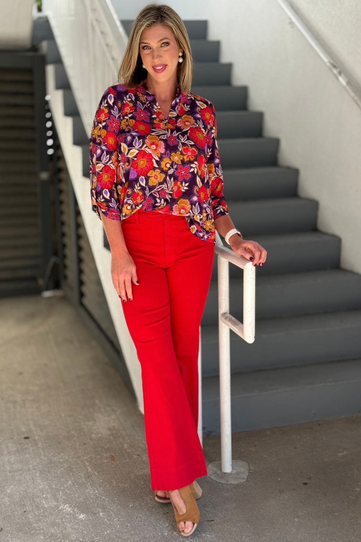 Women’s eggplant floral blouse with red and orange flowers. Dear Scarlett