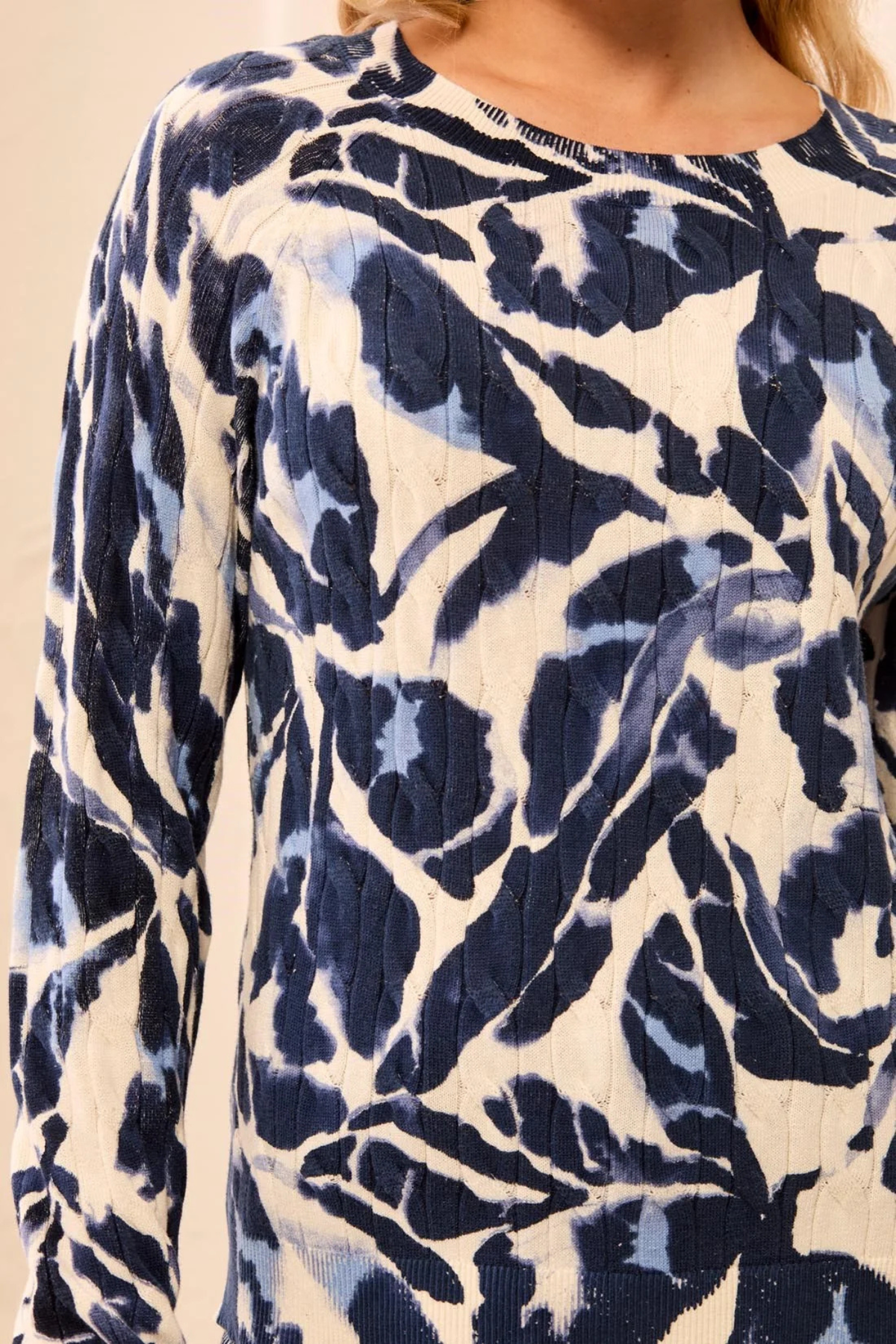 Blue and ivory printed cotton sweater with cable knit texture