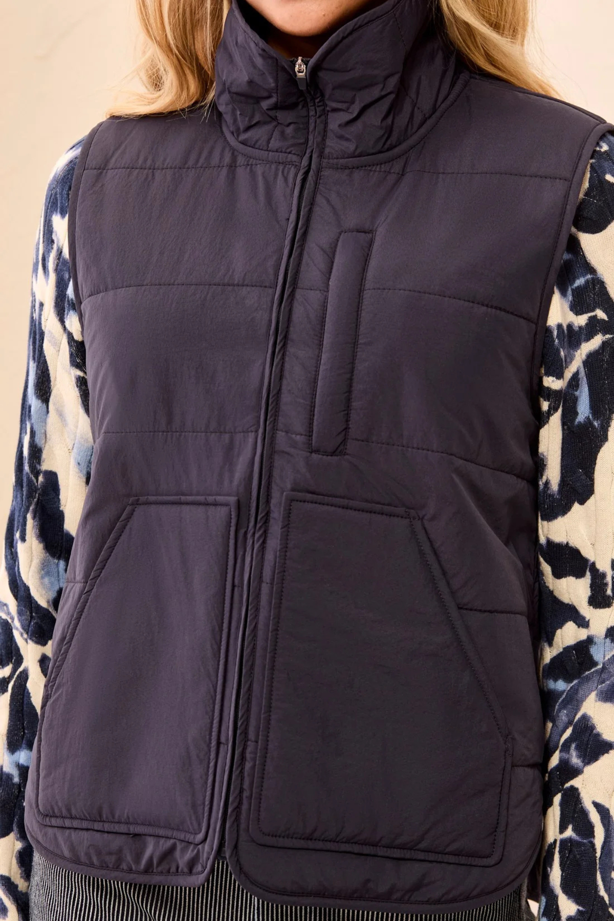Close-up of Tribal Sapphire packable zip-front puffer vest
