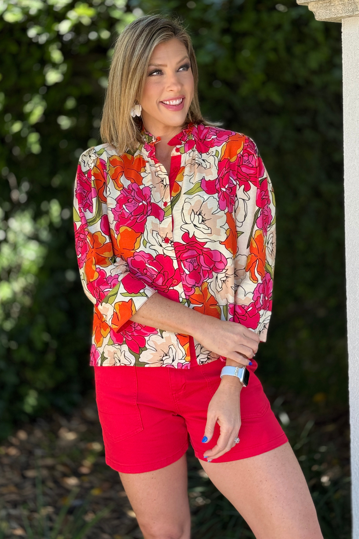 red floral blouse with ruffle neckline