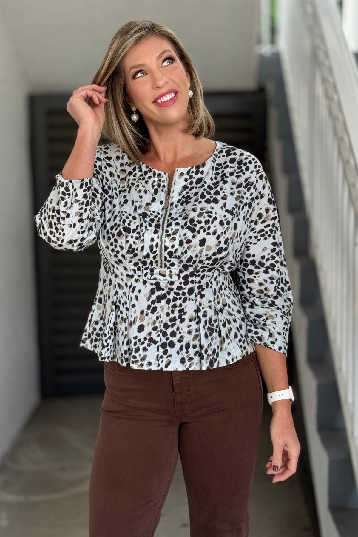 Neutral animal print top with zip front and dolman sleeves