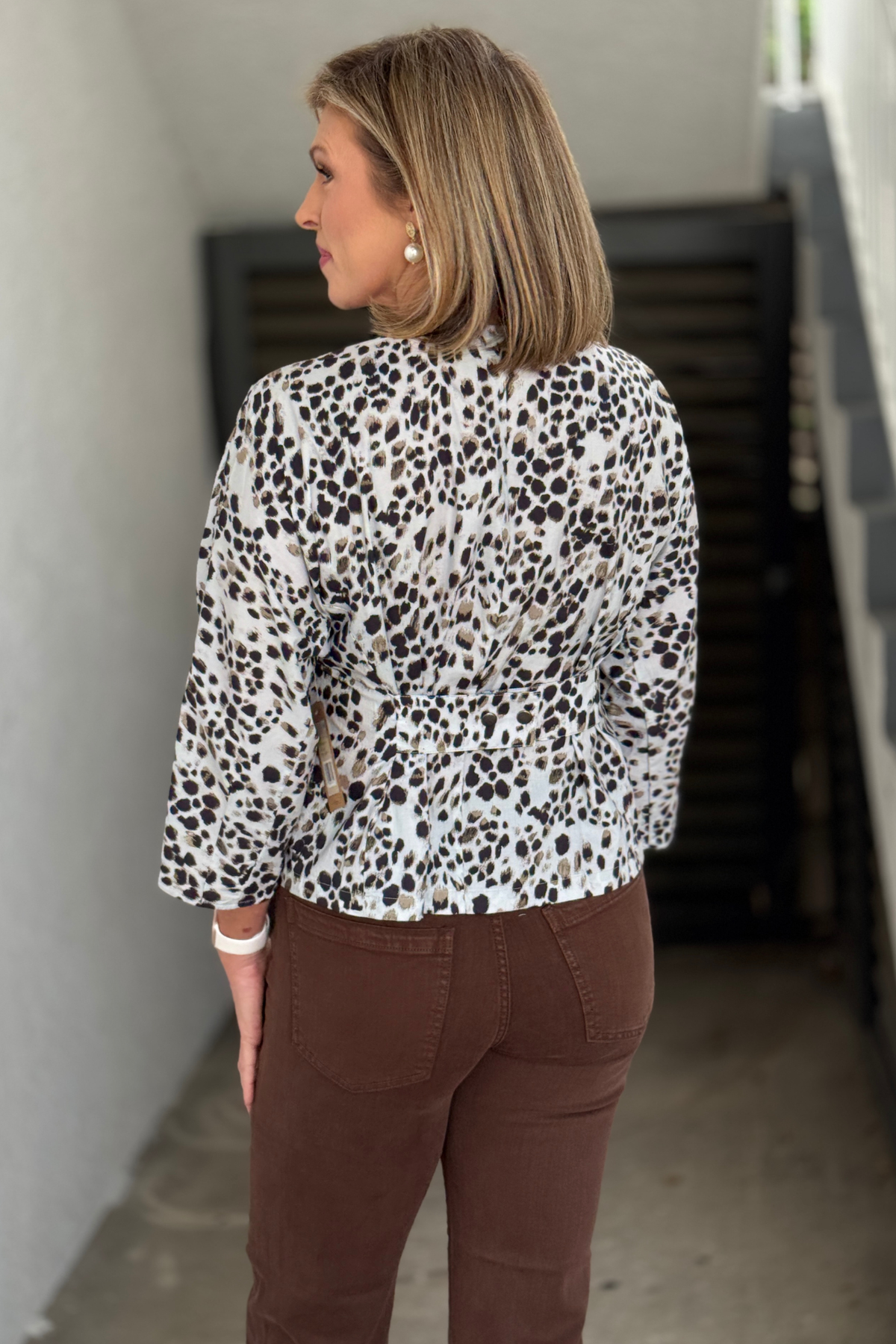 Back view of True Luxe Neutral Animal dolman sleeve top