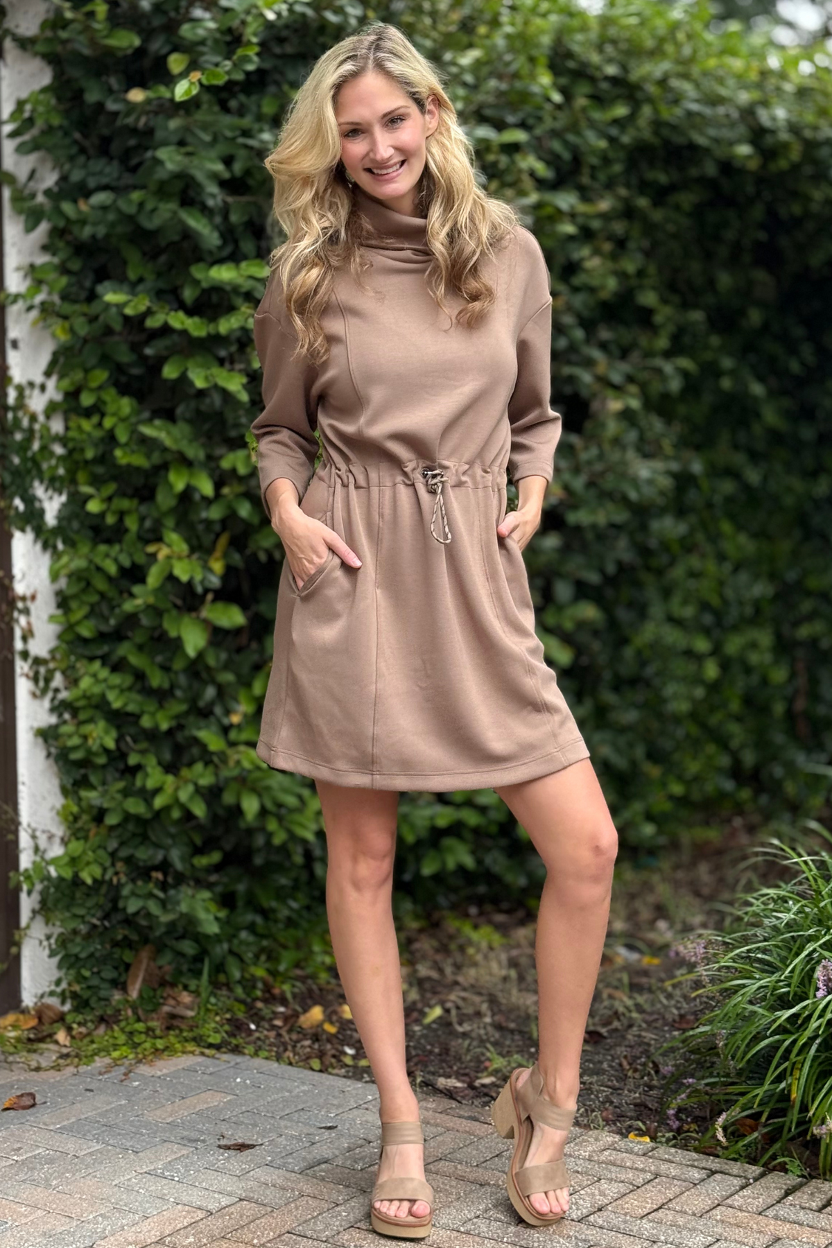 Model wearing the Tribal Cozy Chic Techno Lux Dress with funnel neck and drawcord waist