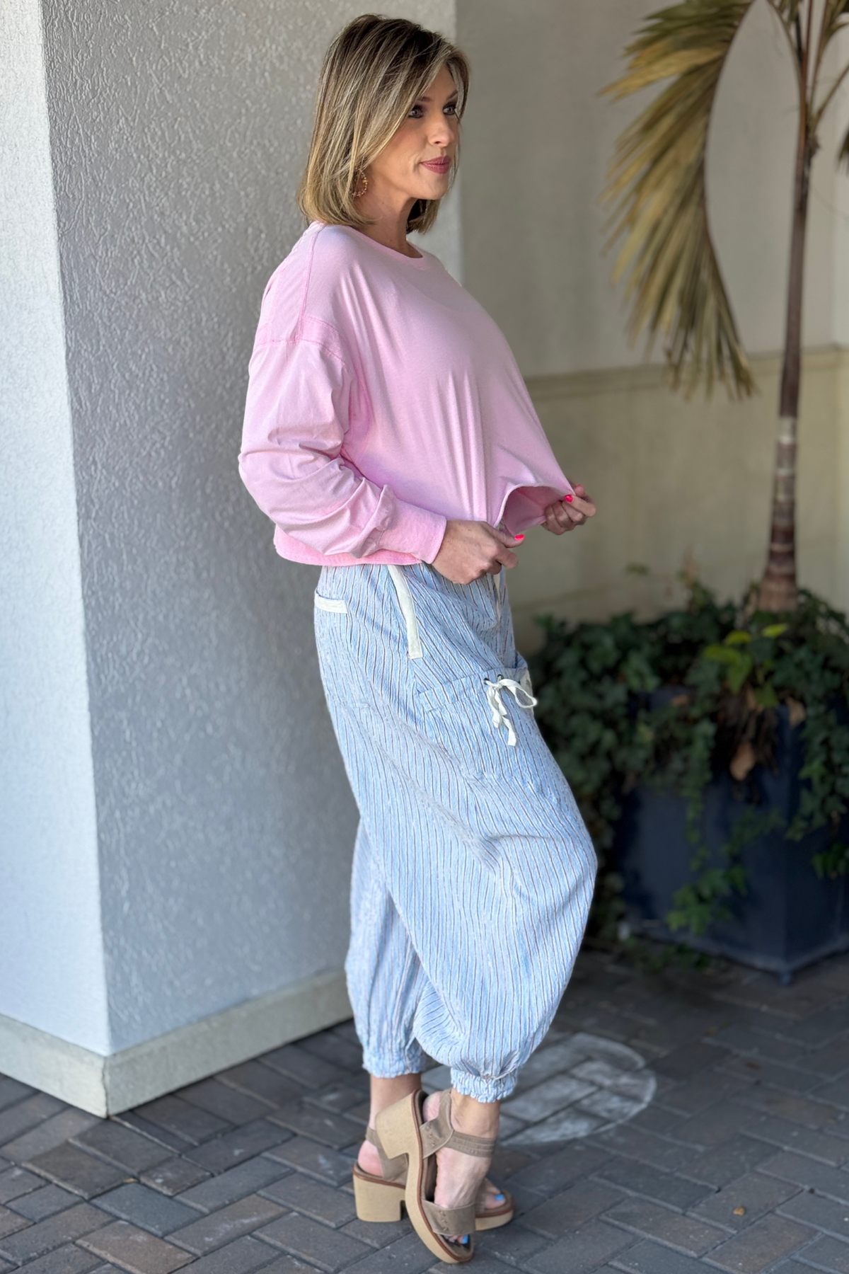 Back view of milky blue striped cargo pants