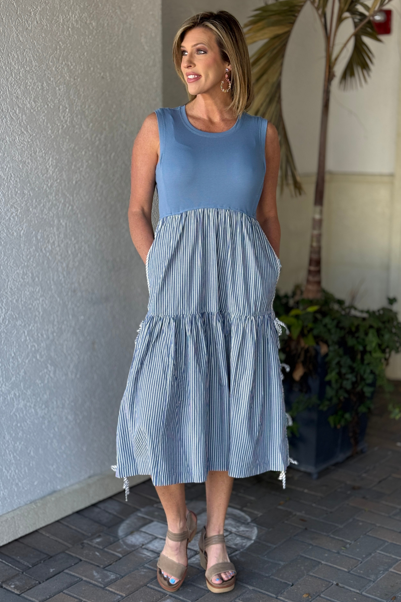 Side view of blue ribbed bodice stripe skirt midi dress