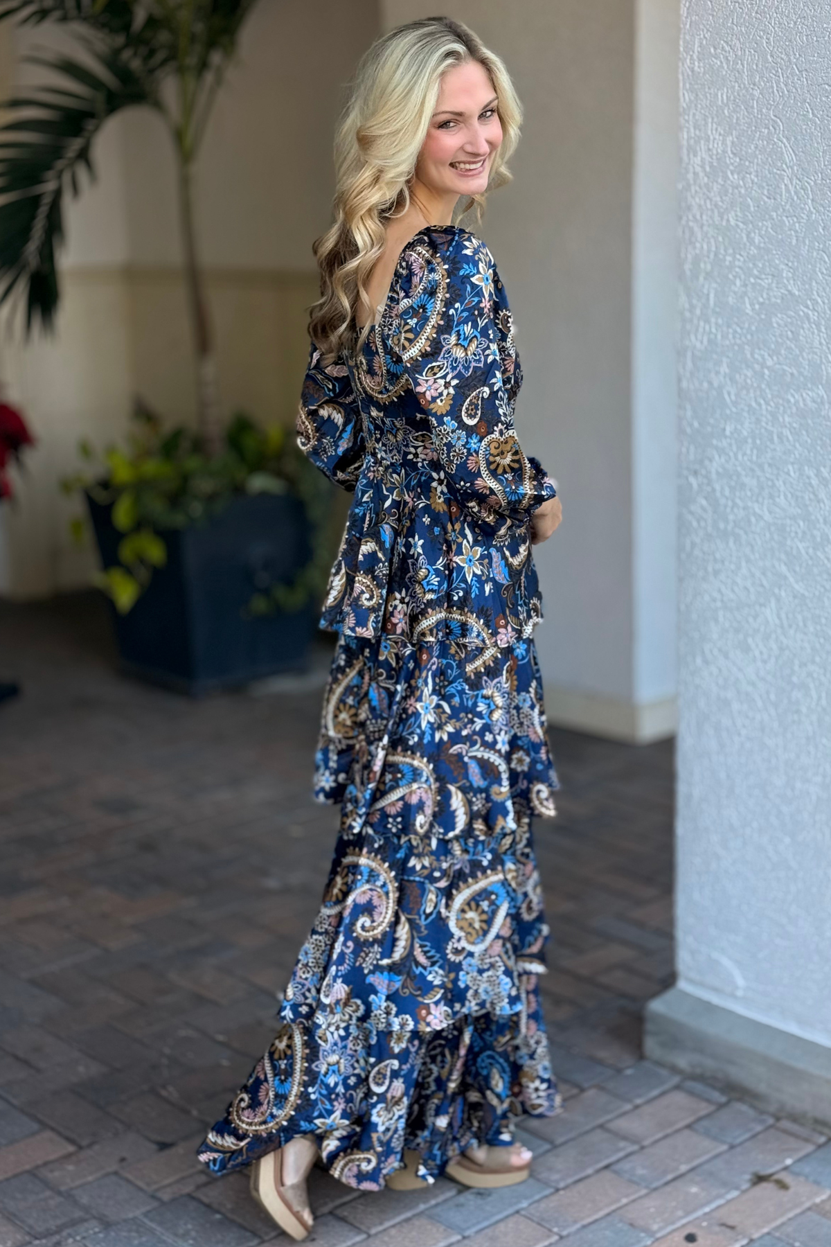 Back view of navy paisley dress with zipper and elastic details