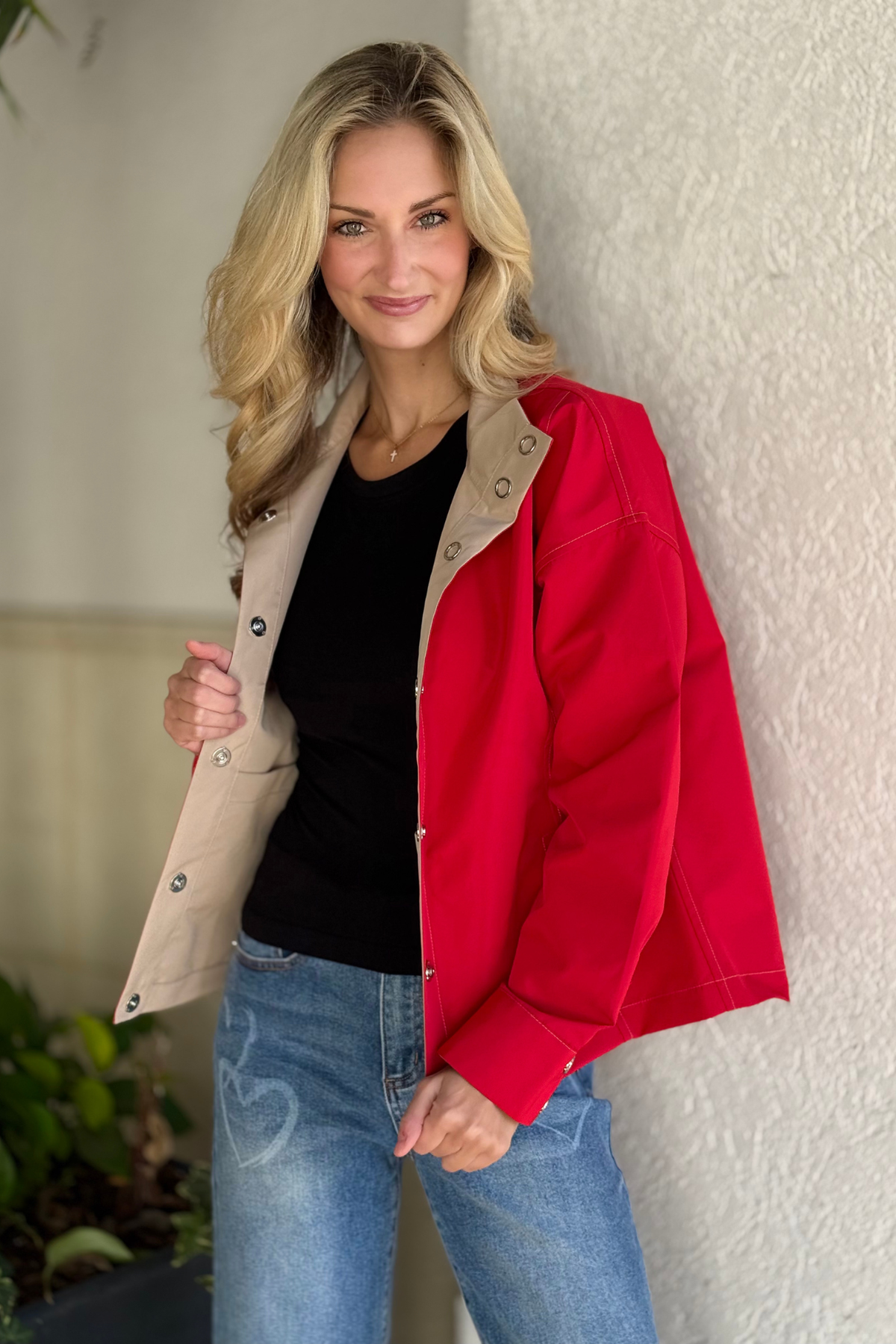 Reversible red and beige jacket with snap closures