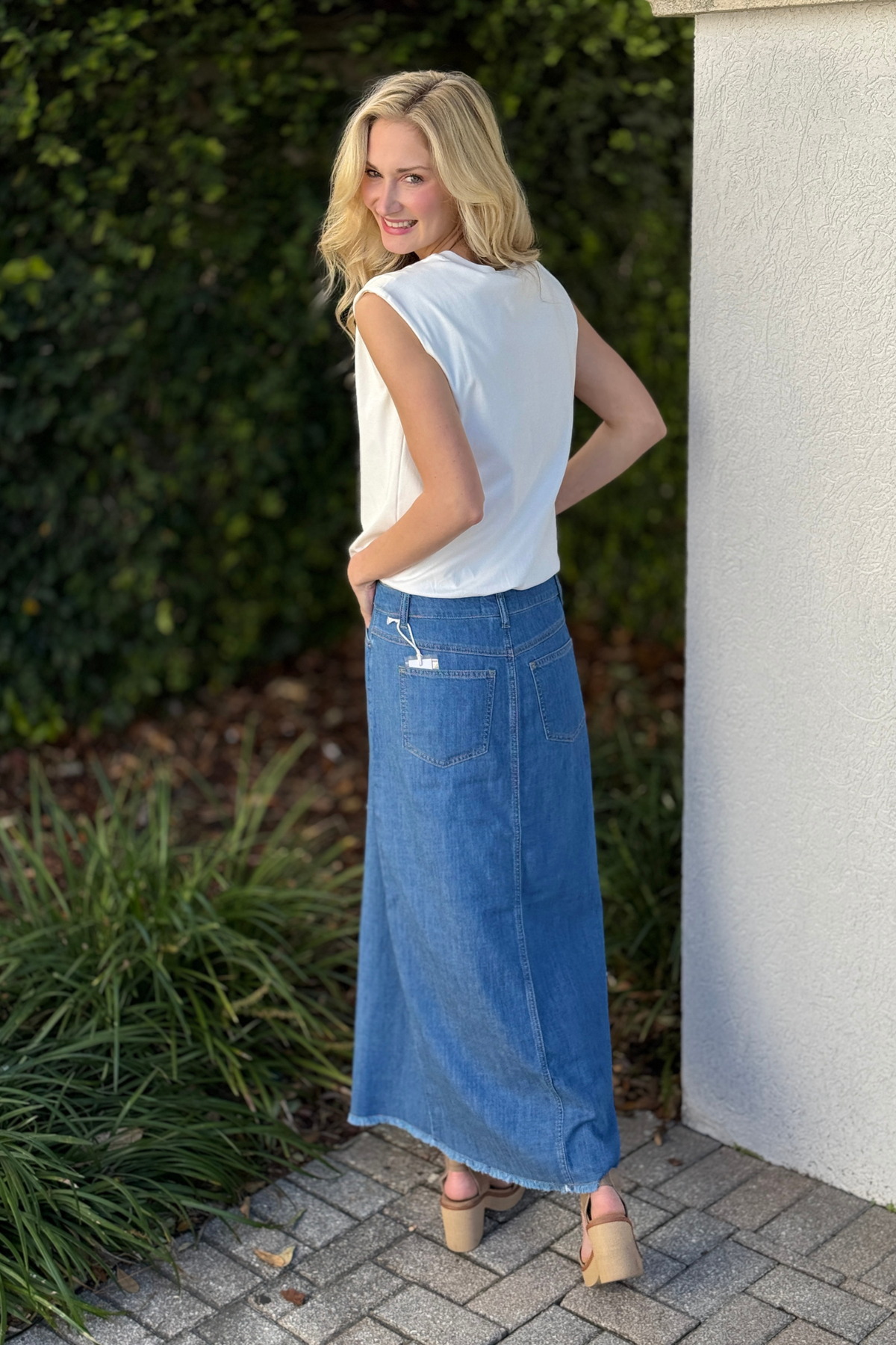Full outfit styling featuring Tribal fjord blue denim maxi skirt paired with neutral platform sandals