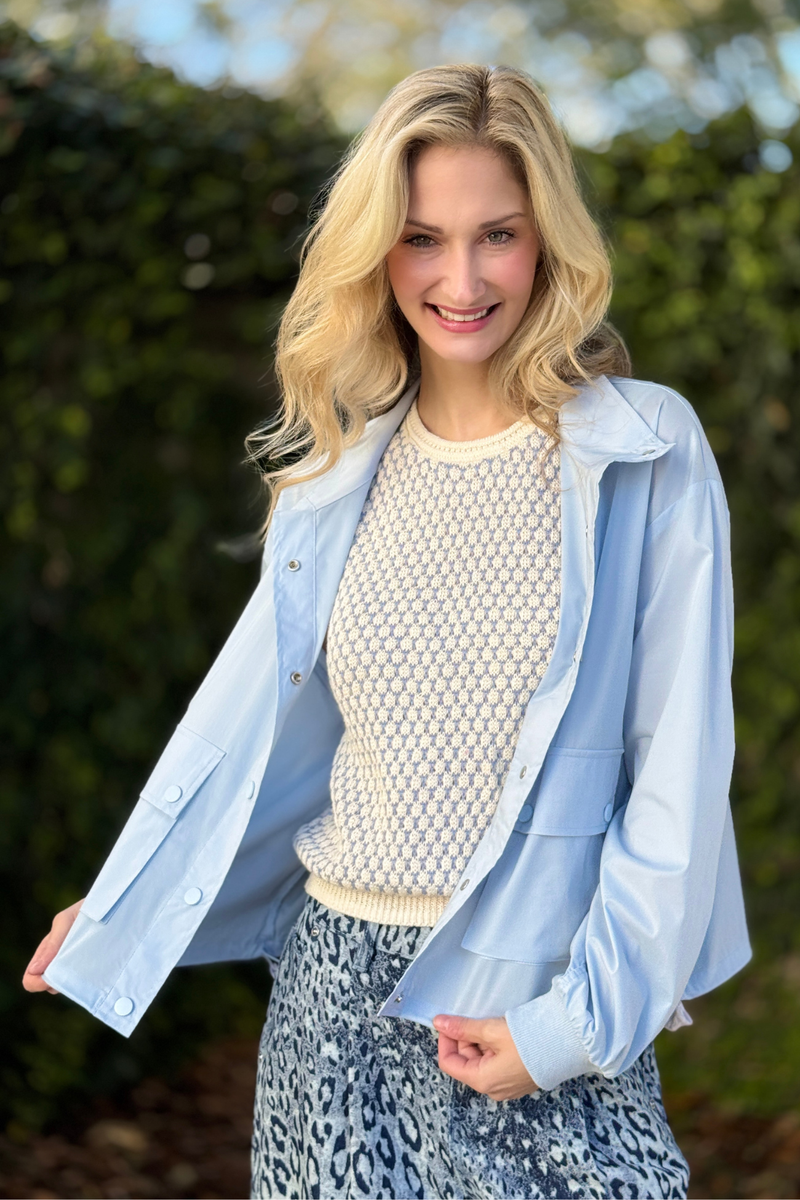 Front view of Tribal adjustable waist windbreaker jacket in soft saltwater blue