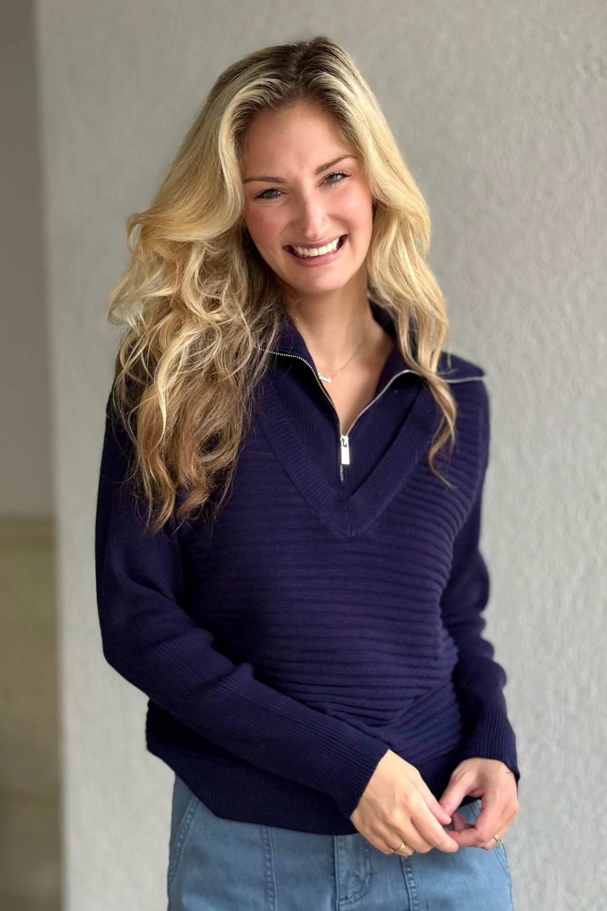 Model wearing the Tribal Starry Nights Zip Sweater in navy with zip V-neckline