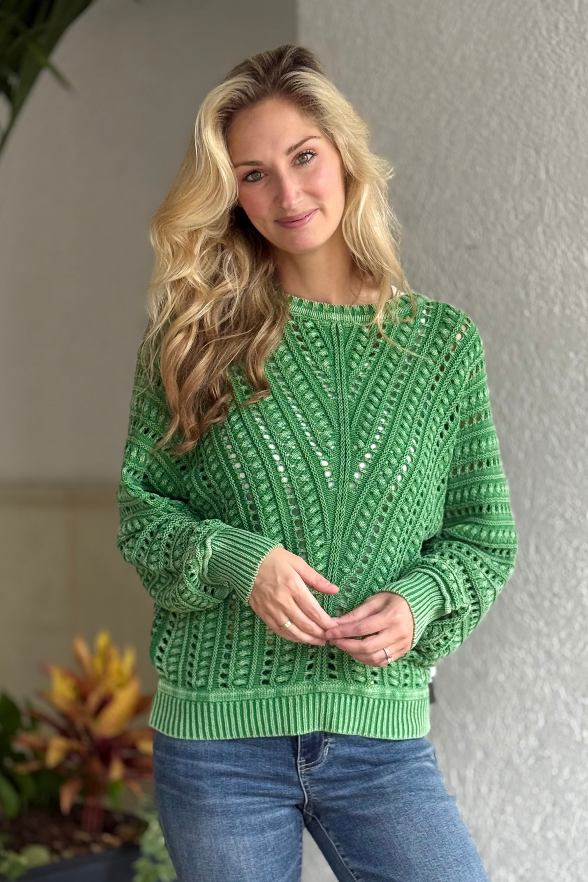 Woman wearing Tribal Fieldstone Textured Crew Sweater in Field Green with basket weave design