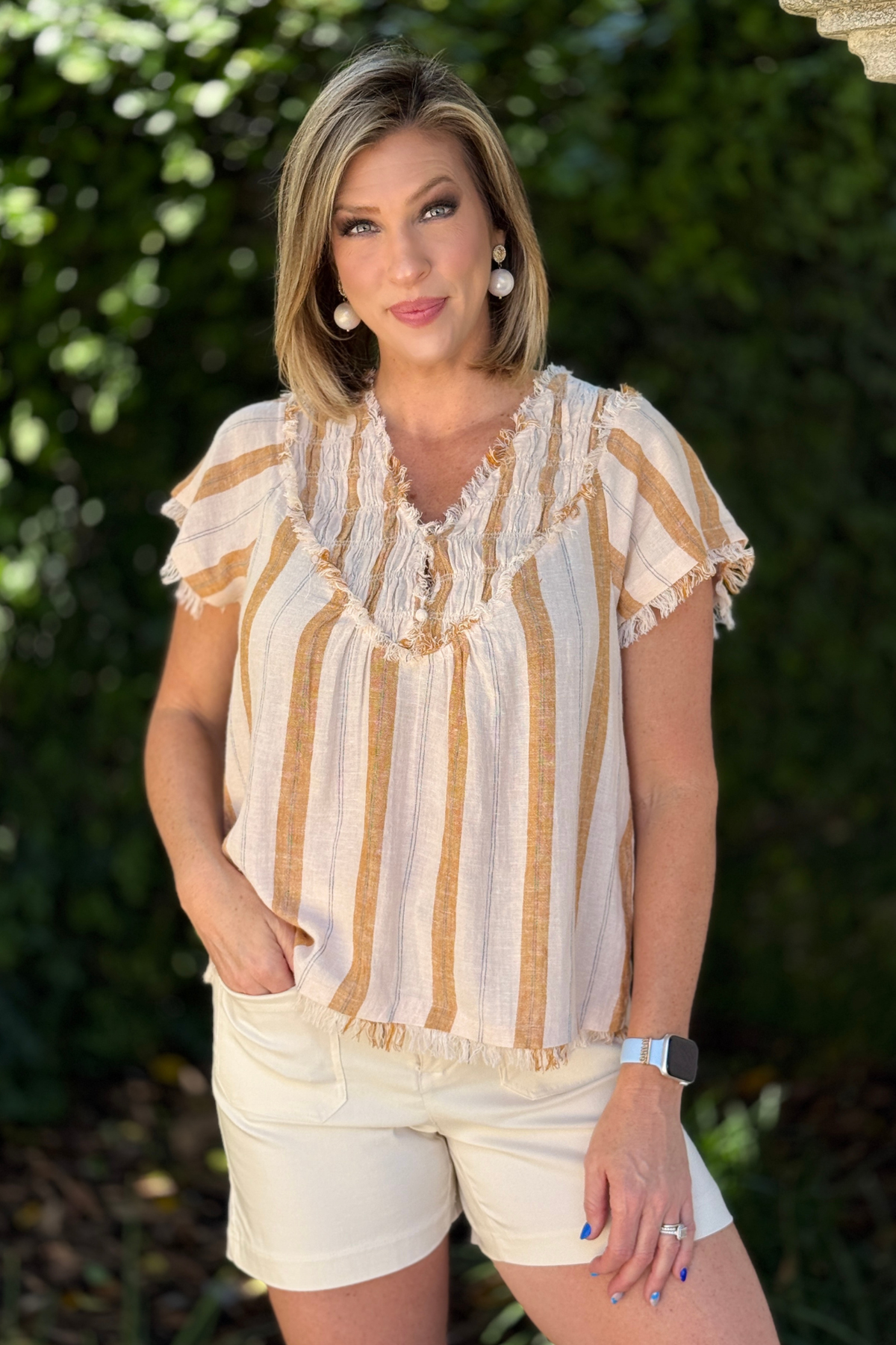Lightweight linen striped top with frayed details and relaxed fit