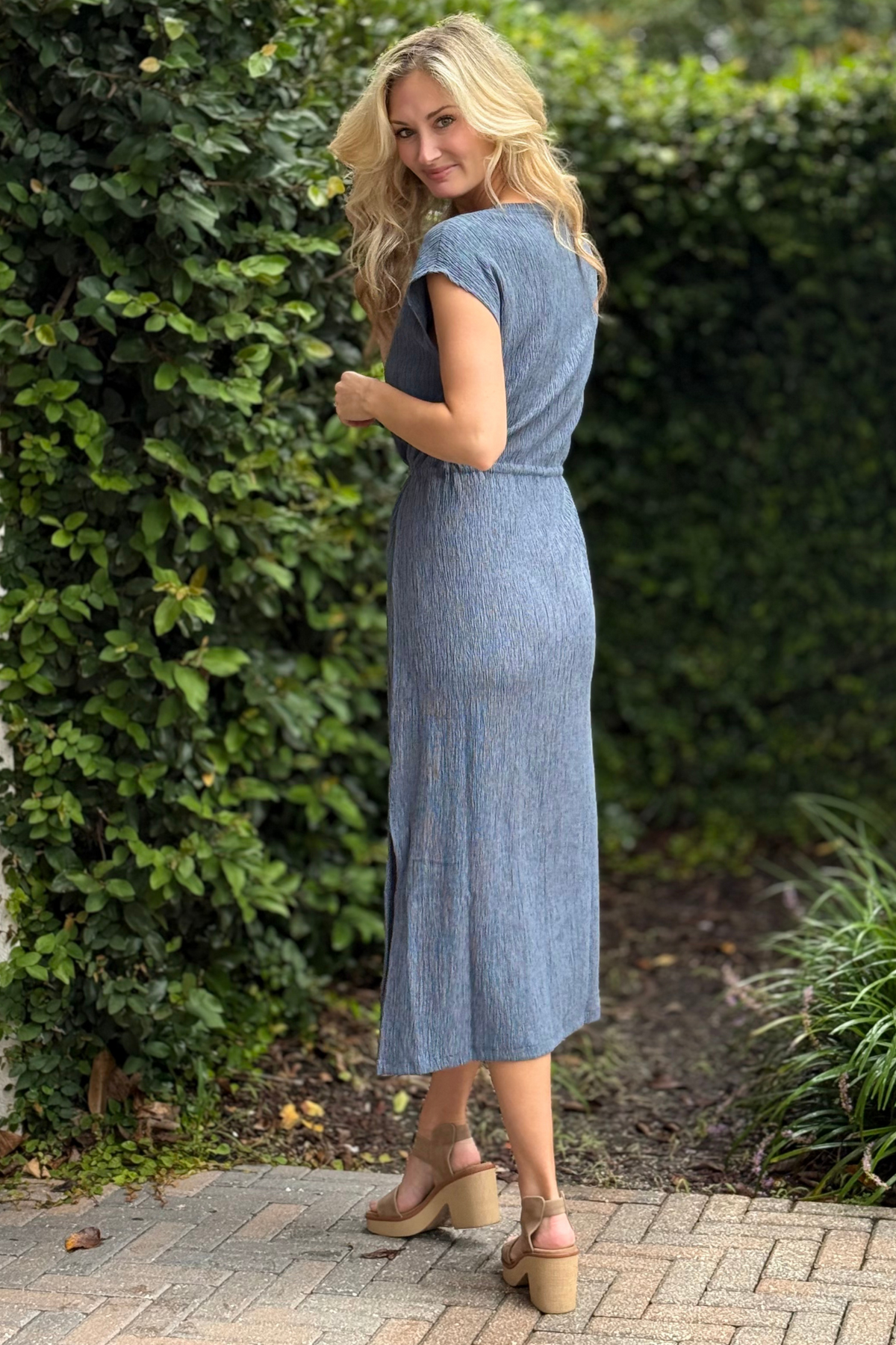 Full-length view of Tribal Fall 2025 Slatebrook Crinkle Knit Midi Dress styled with neutral sandals
