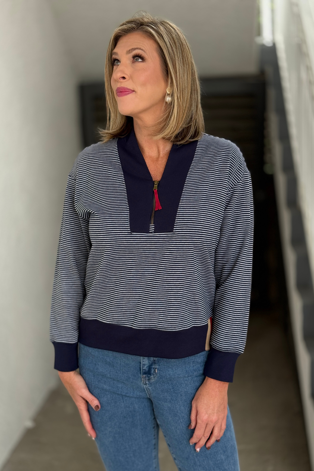 Navy and white striped Tru Luxe pullover styled with denim