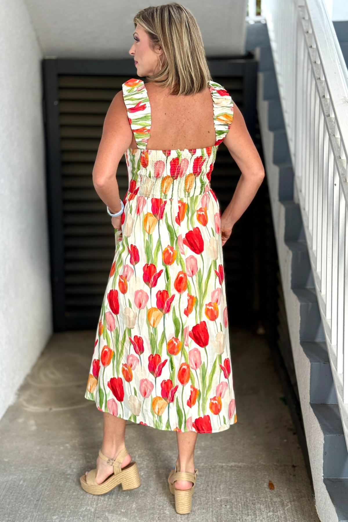 Romantic floral summer dress with flowy midi skirt and smocked back