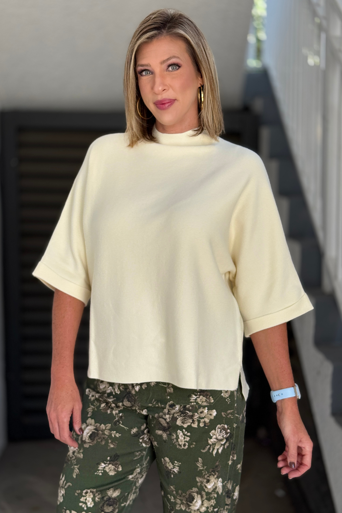 Women's cream short sleeve sweater with side slits