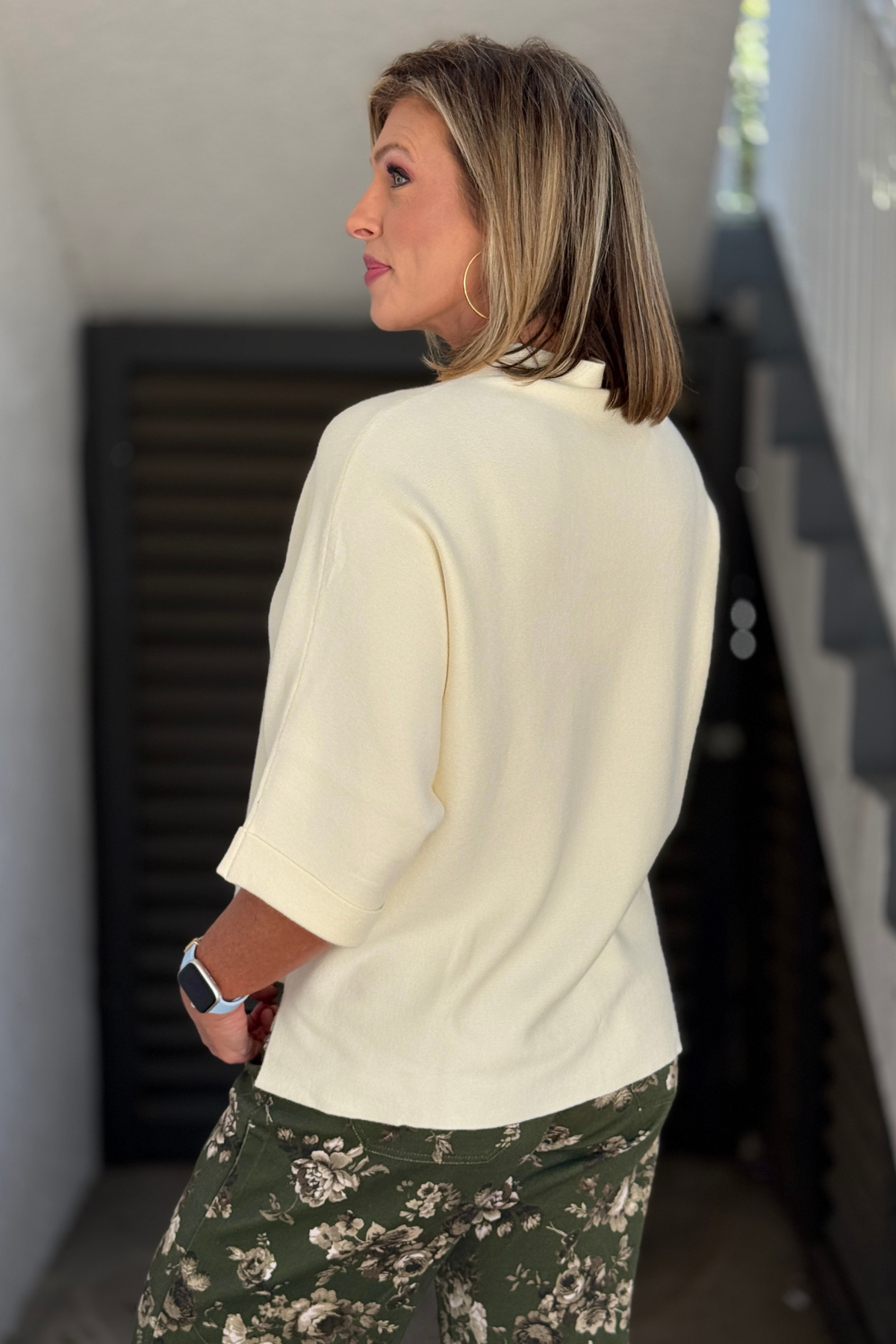 Back view of cream mock neck dolman sweater top