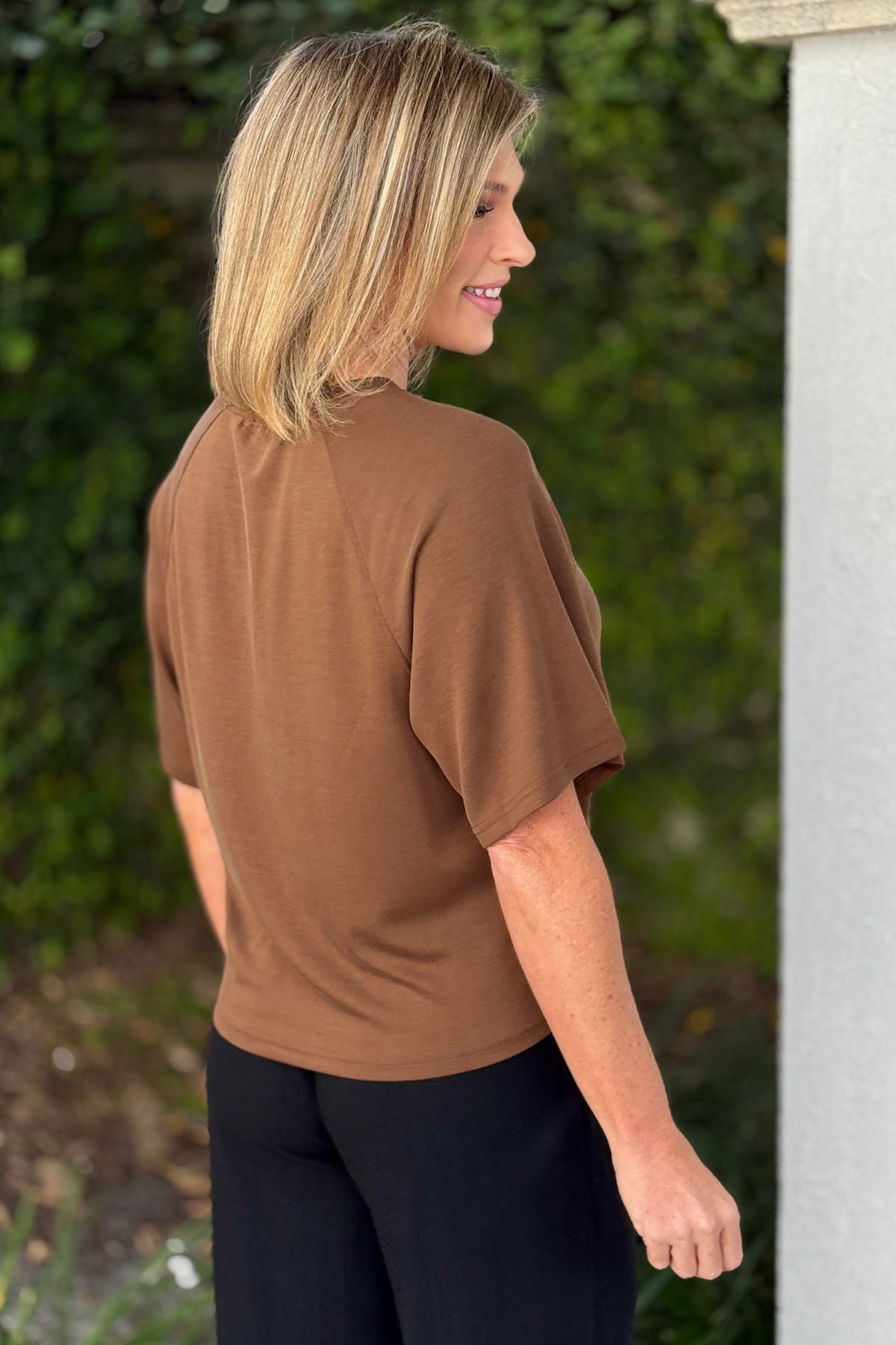 Cocoa raglan sleeve top styled with black pants