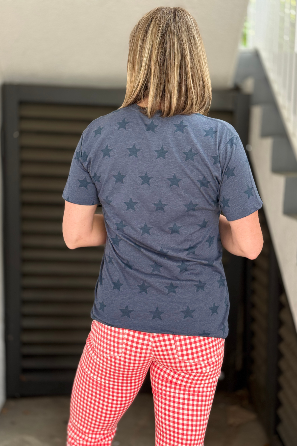 usa shirt styled with red gingham pants