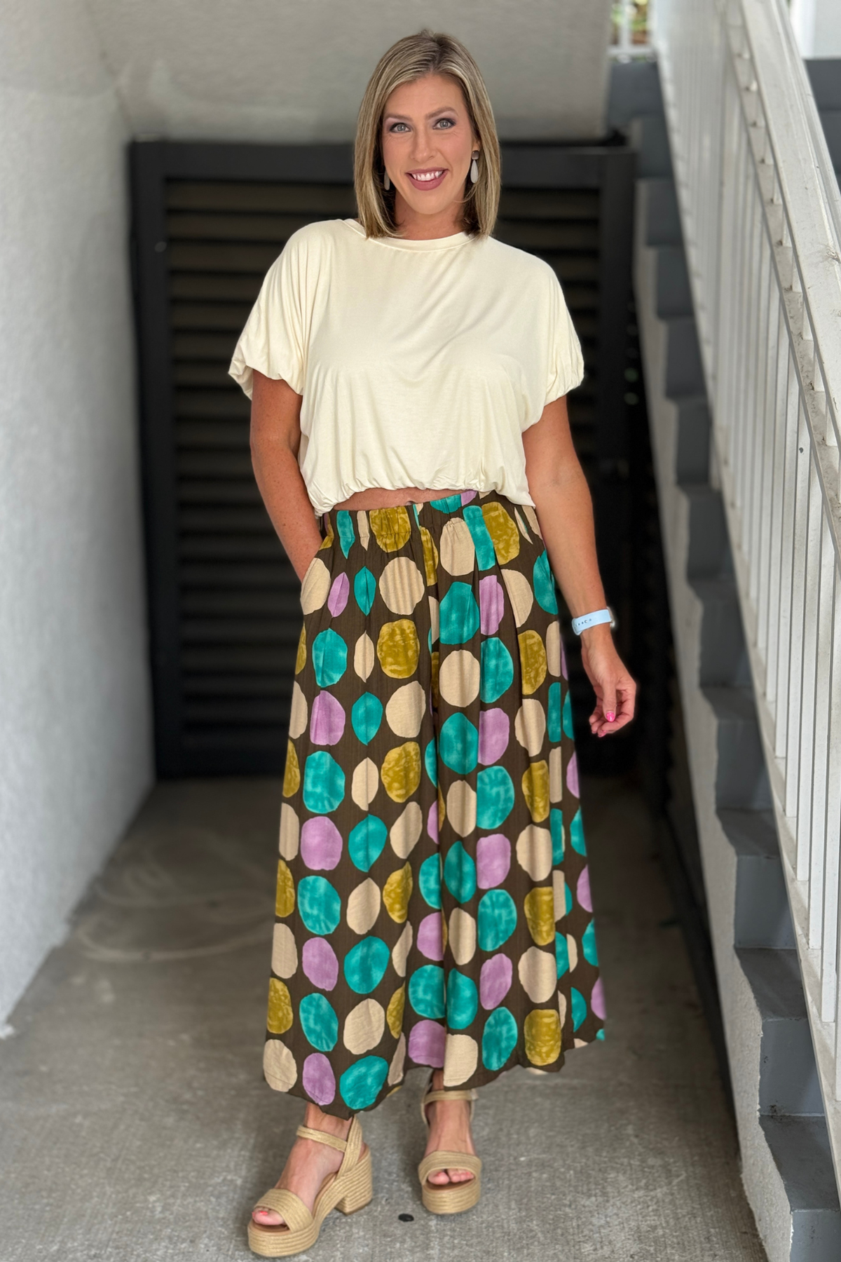 Front view of the Painted Harvest Wide Leg Pants featuring an artistic multicolor print.