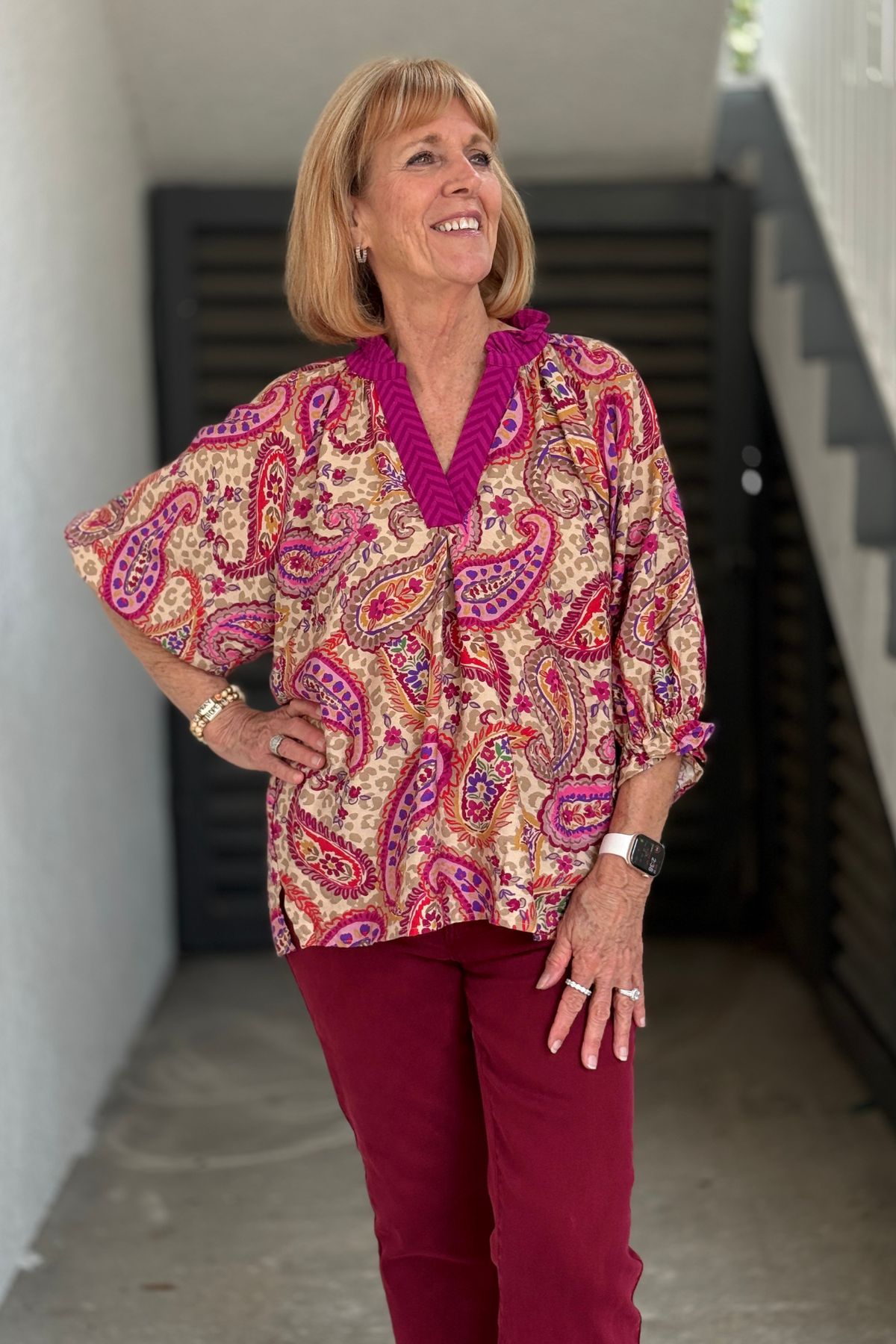 Women's paisley blouse with balloon sleeves and smocked cuffs.