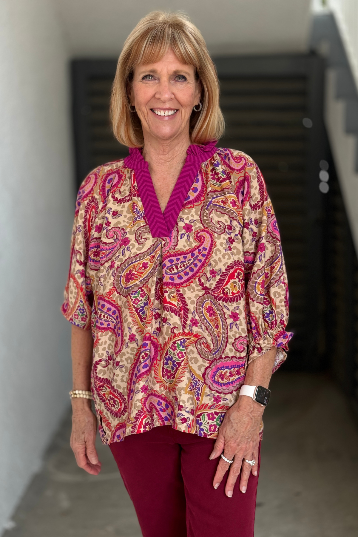 Vibrant paisley print top with high-low hem.