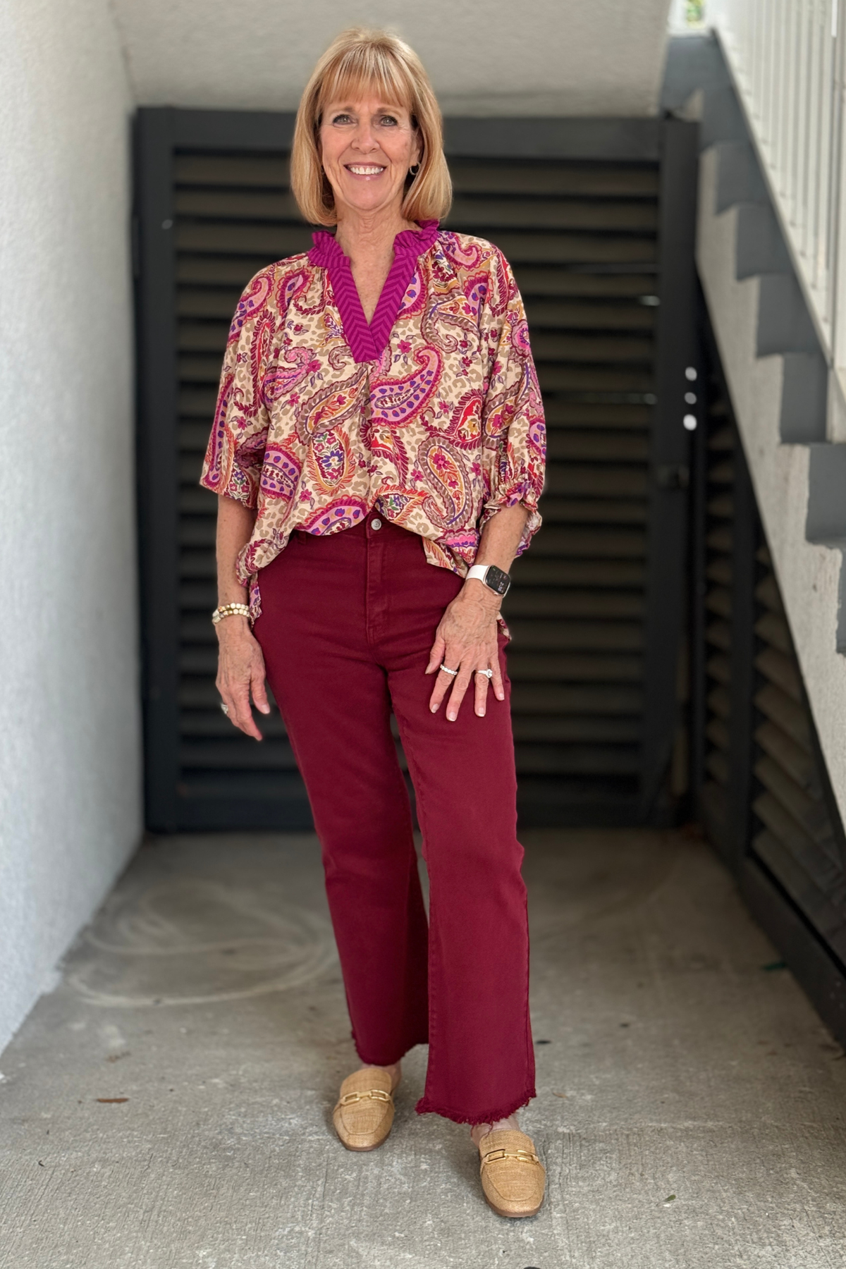 Everyday Cropped Flare Denim in dark burgundy with frayed hem.