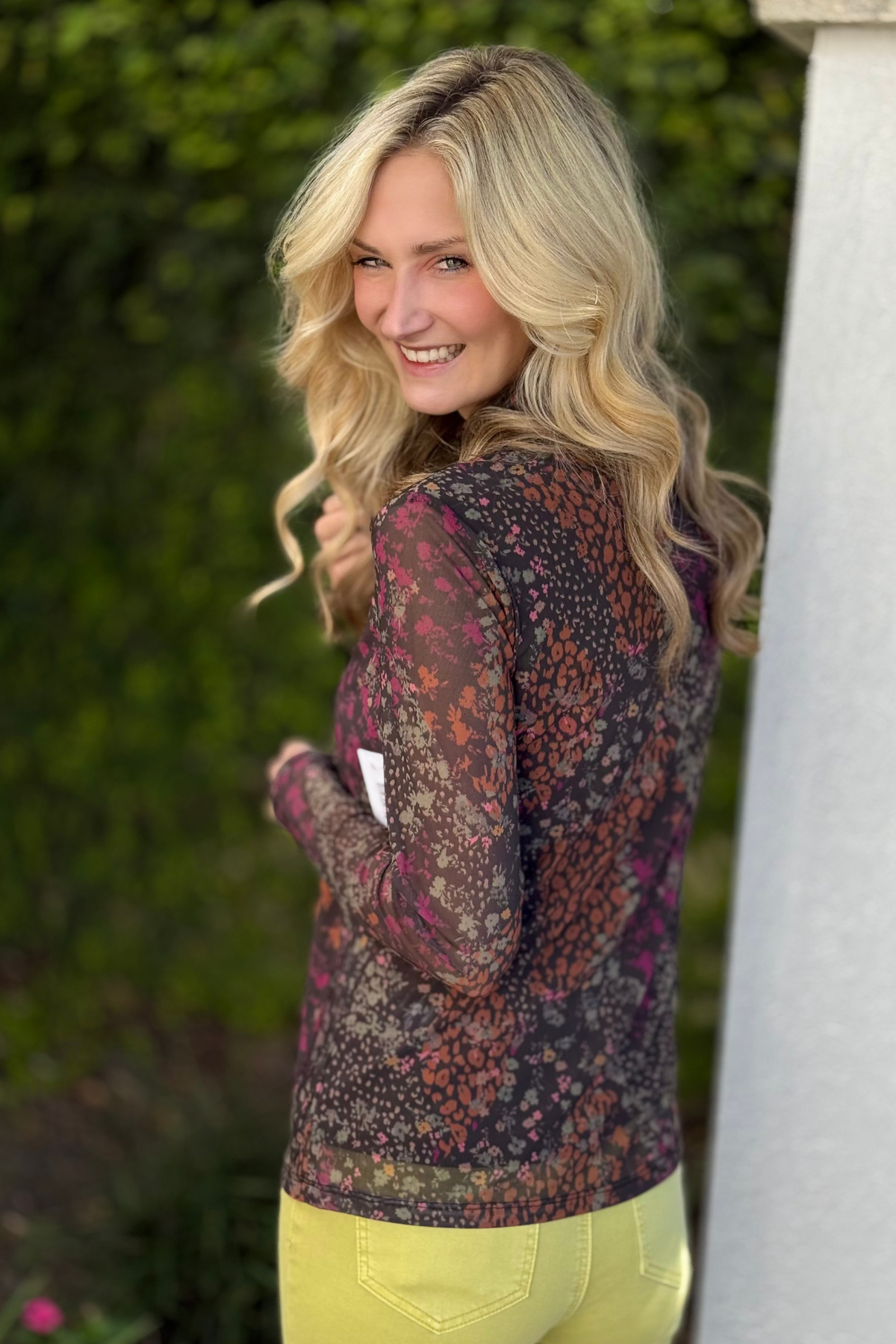 Detail of pop-over turtleneck and long sleeves on Tribal top