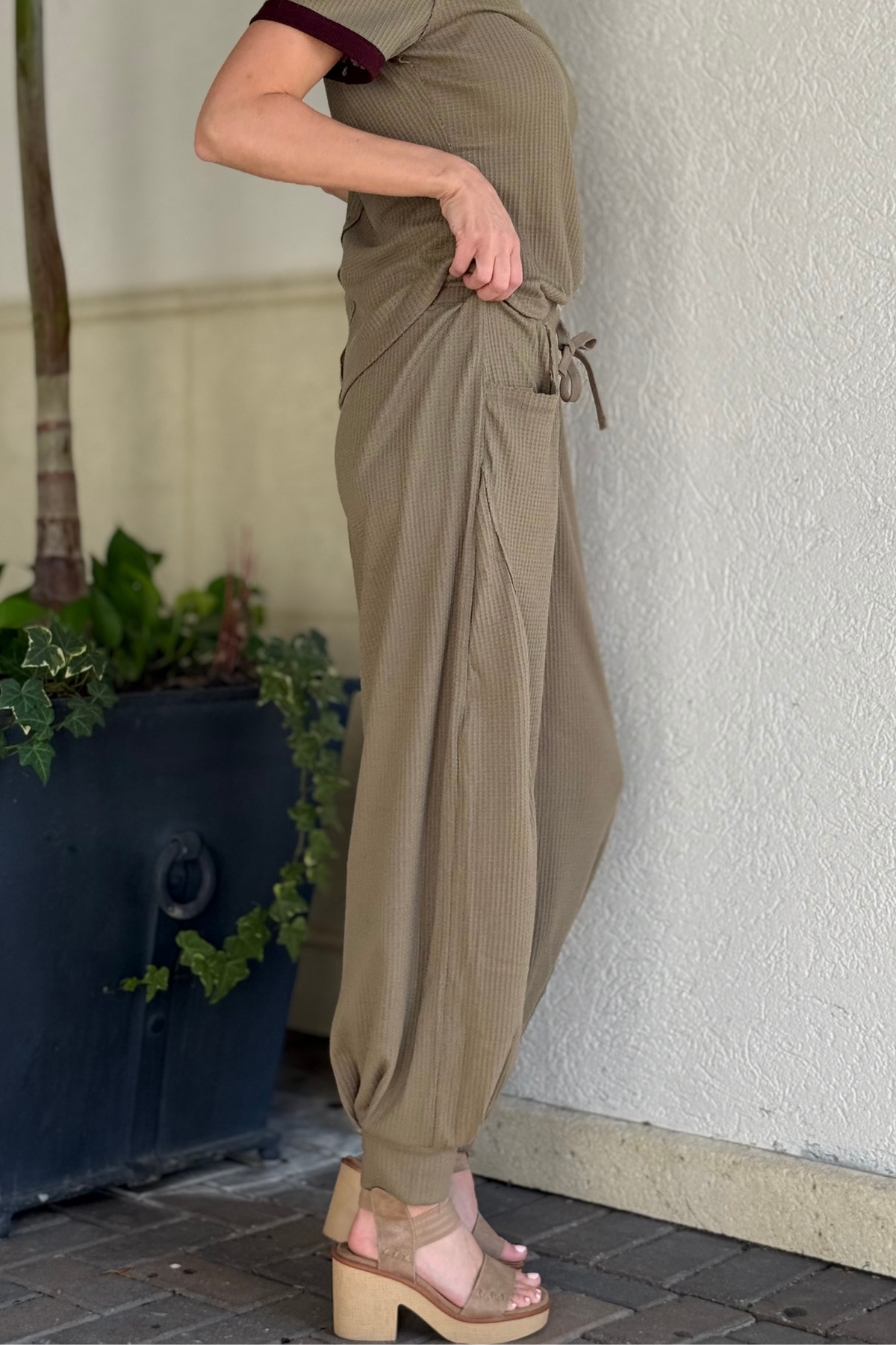 Close-up of waffle knit cocoon joggers with pleated details