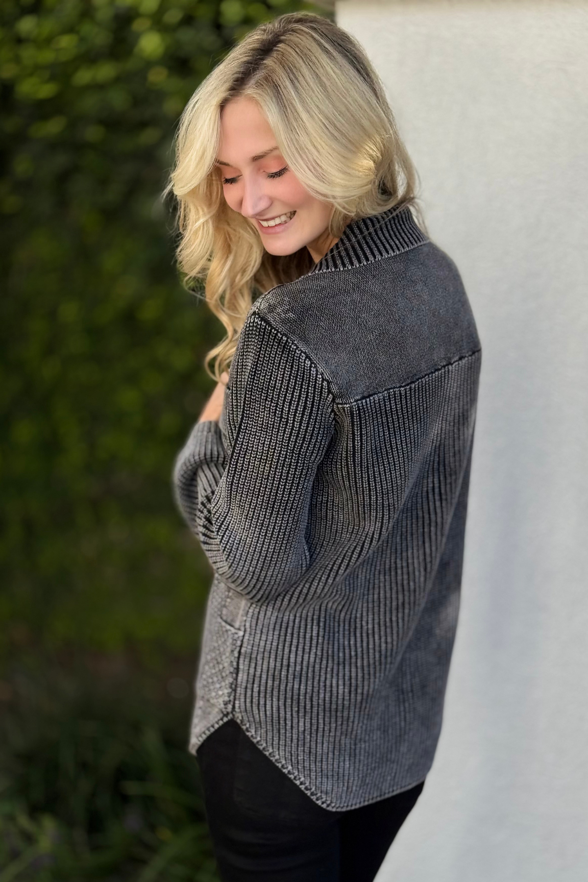 Detail of curved hem and ribbed finishing on Tribal cardigan