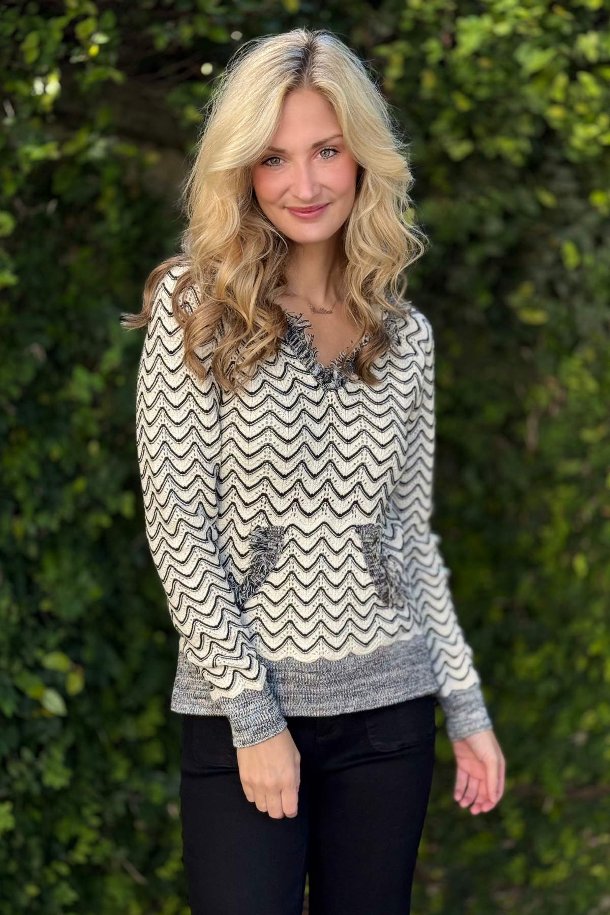 Detail of kangaroo pocket and combed cotton texture on Tribal hooded sweater