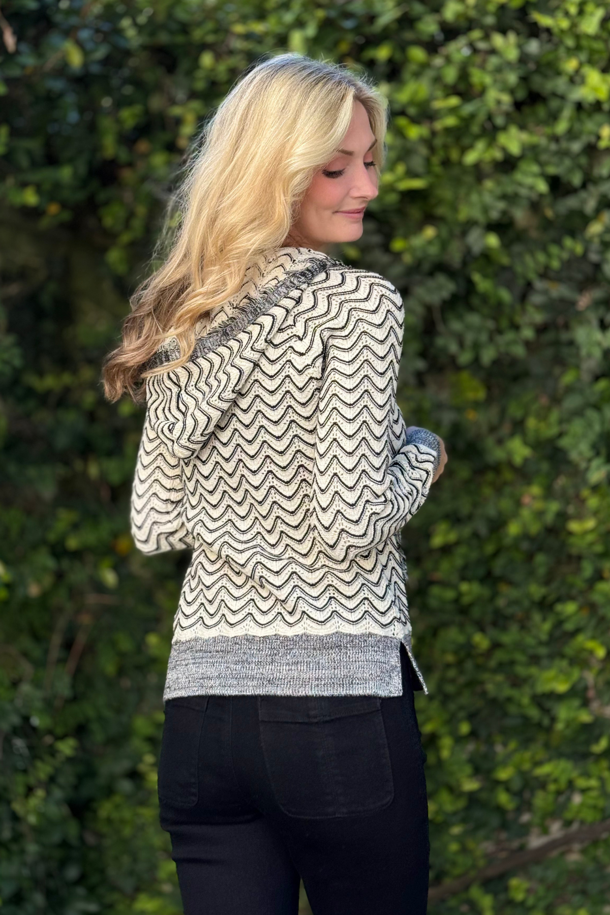 Back view of Tribal Fringe Hooded Sweater in H. Charcoal