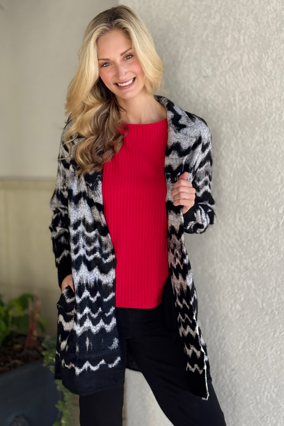 Woman wearing Liverpool black grey wavy stripe open front coatigan sweater