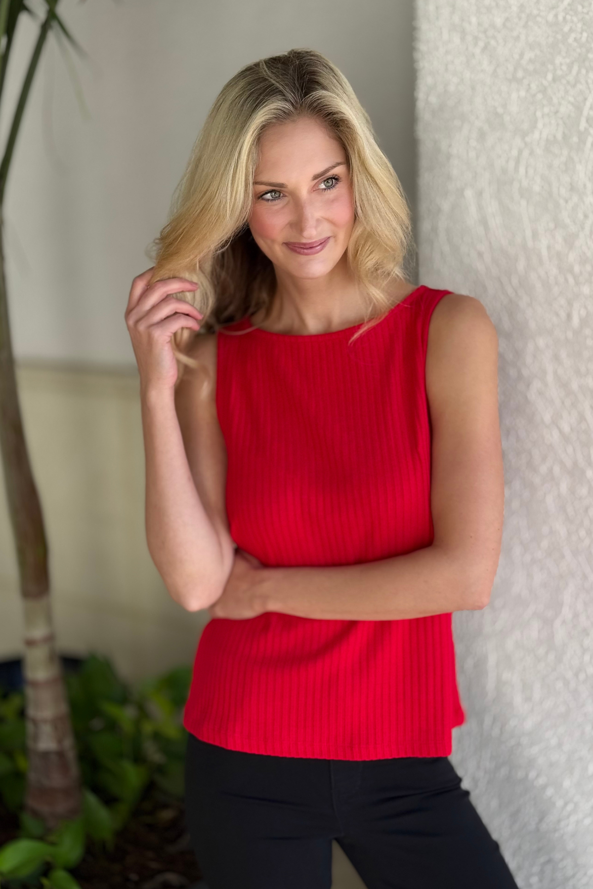 Woman wearing Liverpool Sleeveless Boat Neck Rib Knit Top in Tango Red