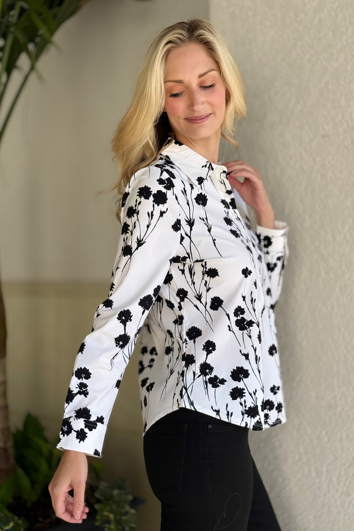 Front view of button-front knit floral shirt on model