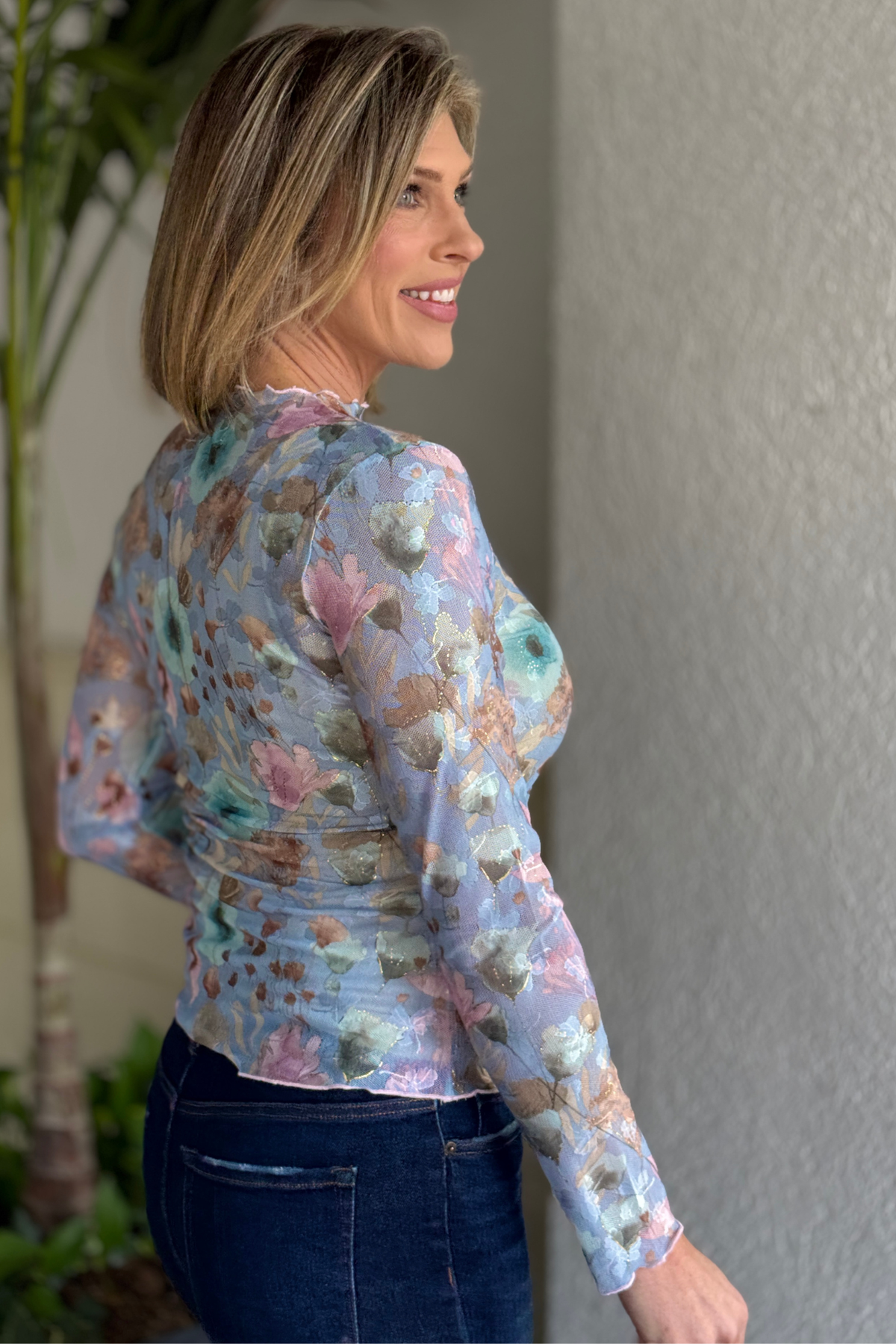 Close up of pastel floral tie dye mesh long sleeve top