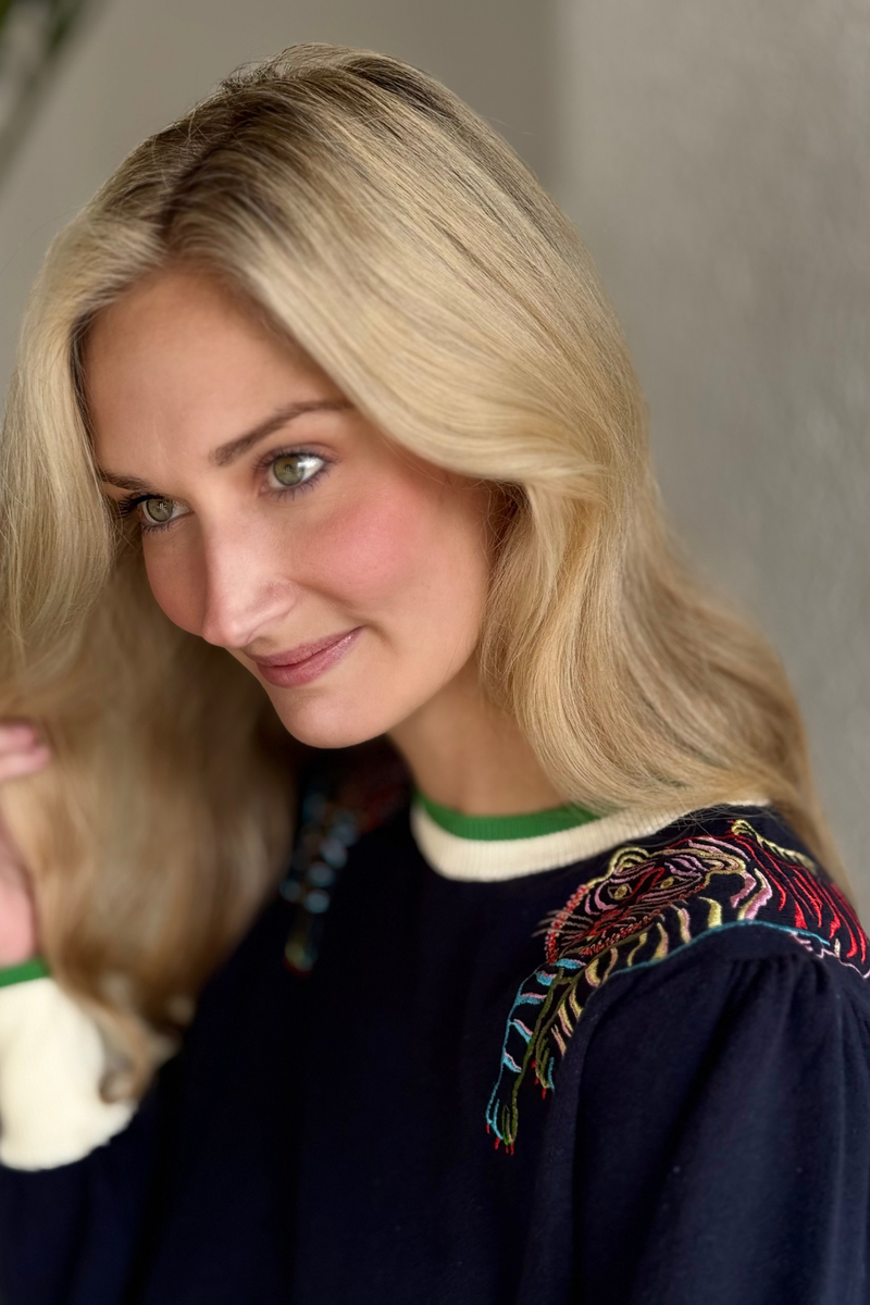 Close-up of tiger embroidery on shoulder detail