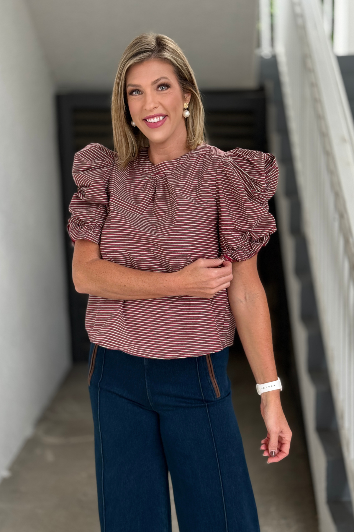 Women’s burgundy and cream striped top with statement puff sleeves