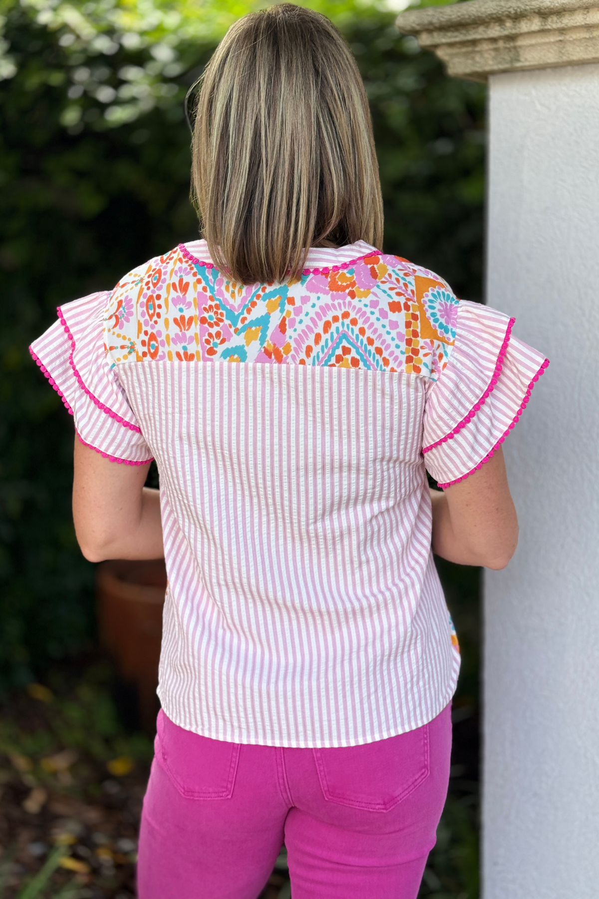 Boho inspired women’s top styled with denim shorts
