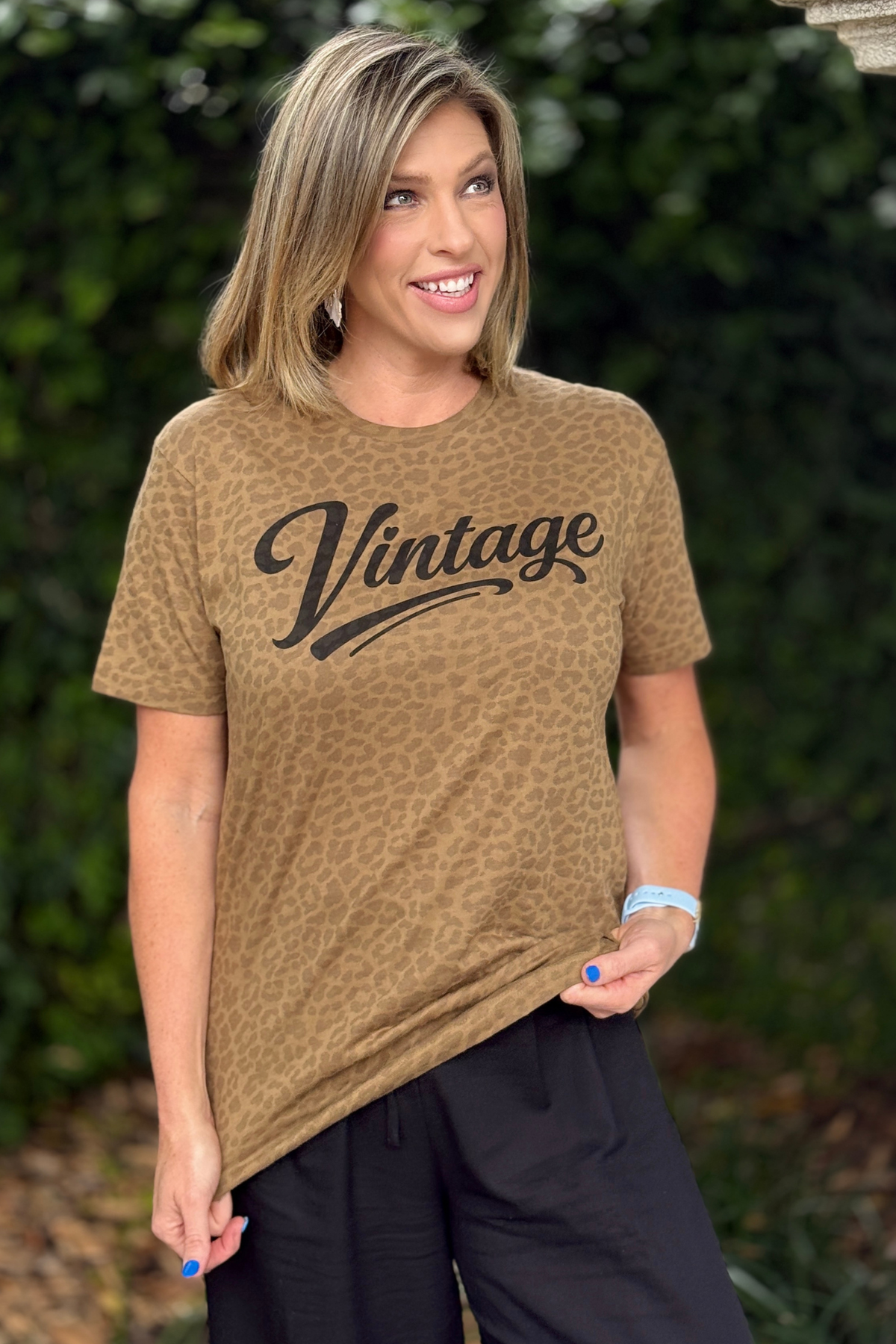 leopard print graphic tee with vintage lettering in black
women’s animal print t shirt styled casually with black pants